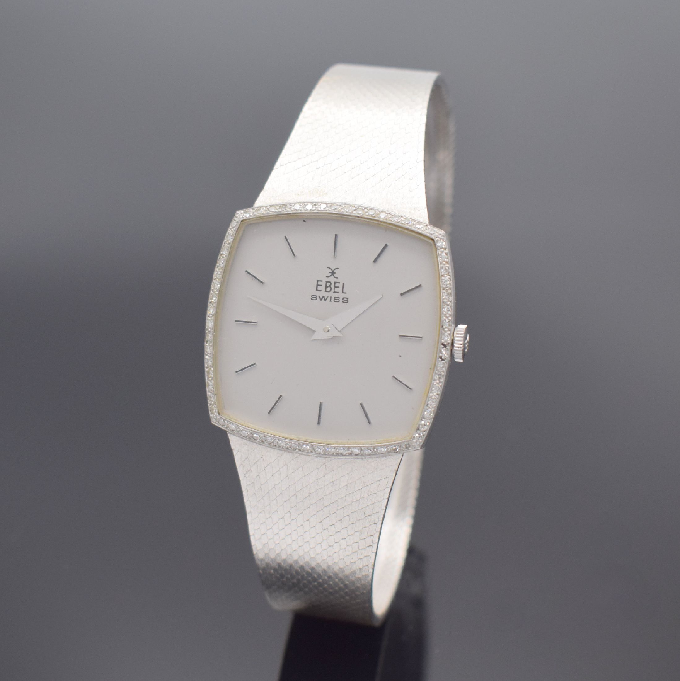 EBEL Herrenarmbanduhr in WG 750/000 Referenz 8107 B, Schweiz um 1975, Handaufzug, 2-teil. Geh., Boden aufgedr., Lünette m. Diamanten bes., silb. ...