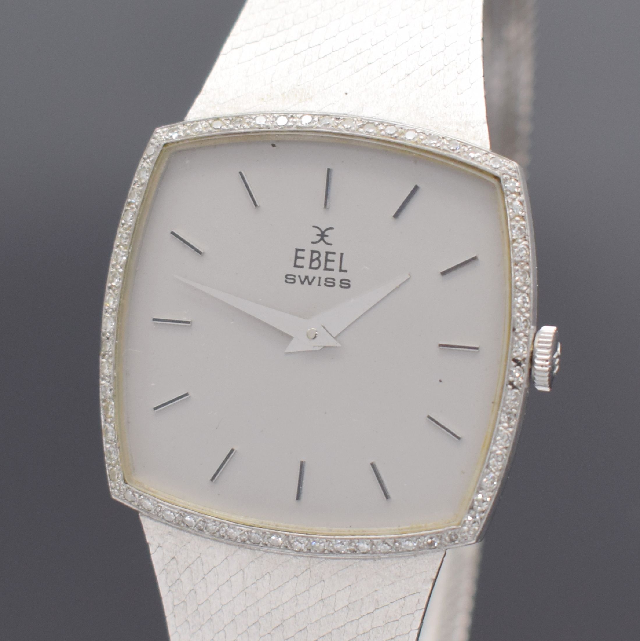 Detail a: EBEL Herrenarmbanduhr in WG 750/000 Referenz 8107 B, Schweiz um 1975, Handaufzug, 2-teil. Geh., Boden aufgedr., Lünette m. Diamanten bes., silb. ...