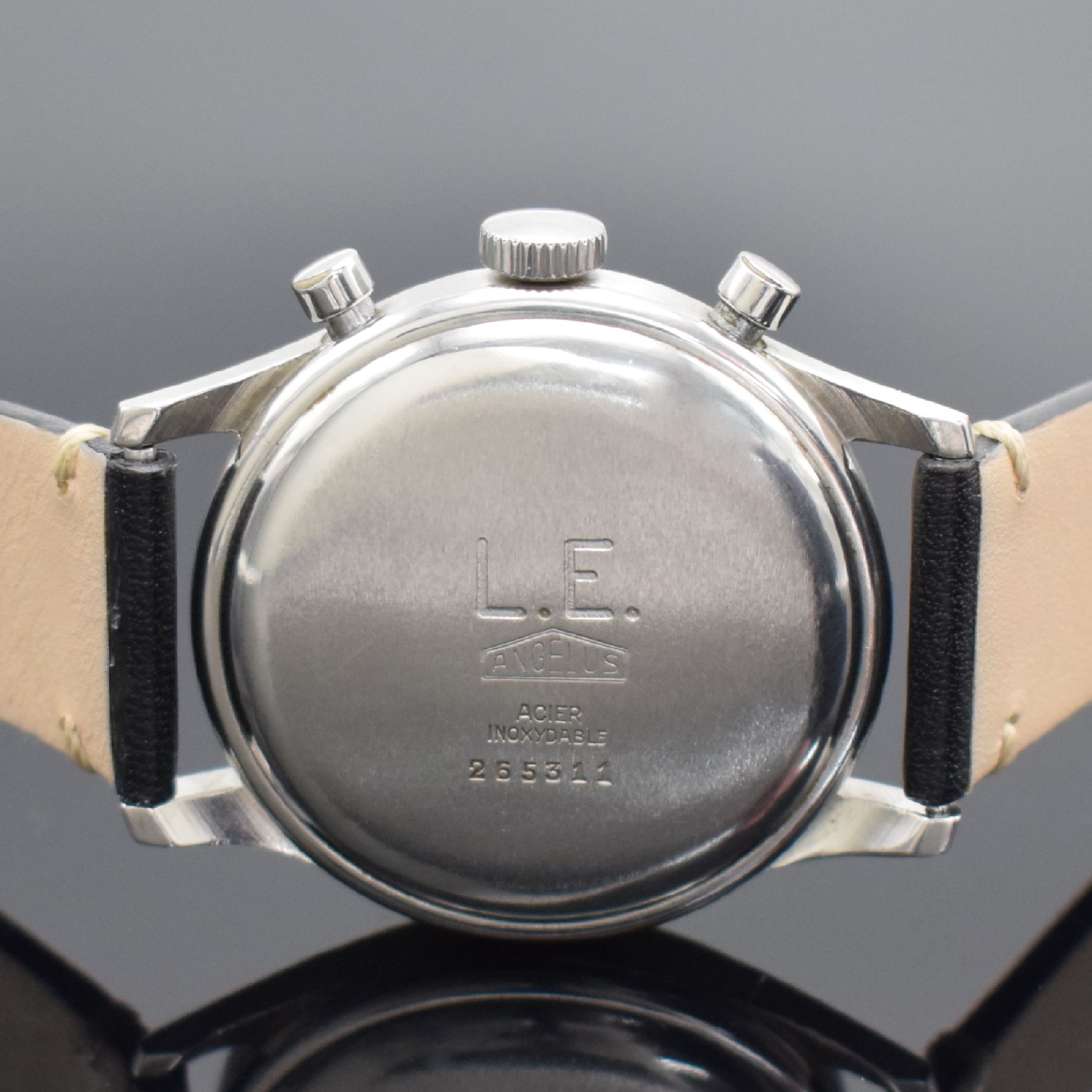 Detail c: ANGELUS Herrenchronograph mit Schaltrad in Stahl, Schweiz um 1945, Handaufzug, Boden aufgedr., schwarzes Zifferbl. rest., arab. Leuchtzahlen, ...