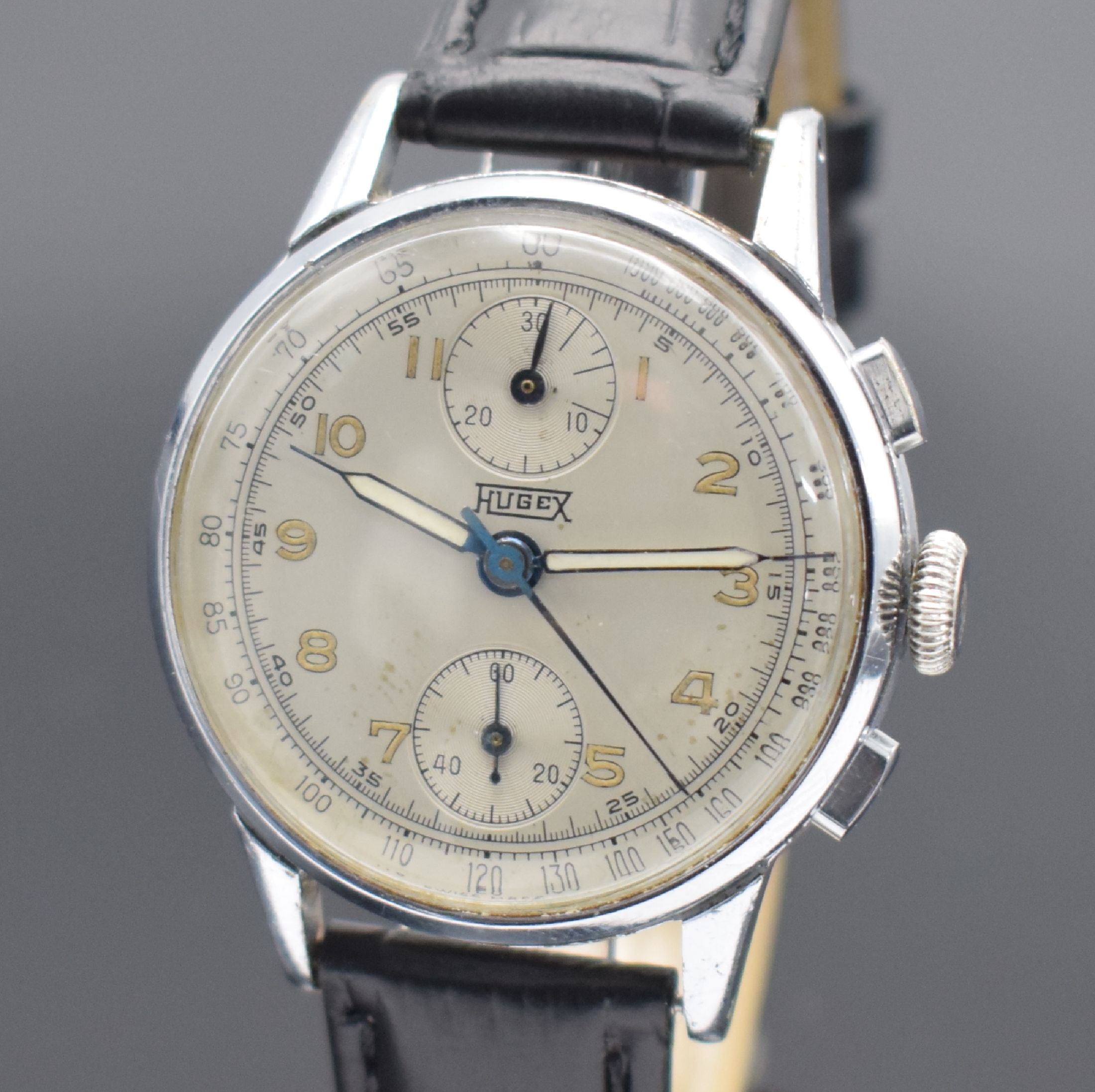 Detail a: HUGEX Herrenchronograph mit Schaltrad, Schweiz um 1950, Handaufzug, verchr. Geh., Stahlboden aufgedr., silb. Zifferbl. fl., arab. Leuchtzahlen, gebl. ...