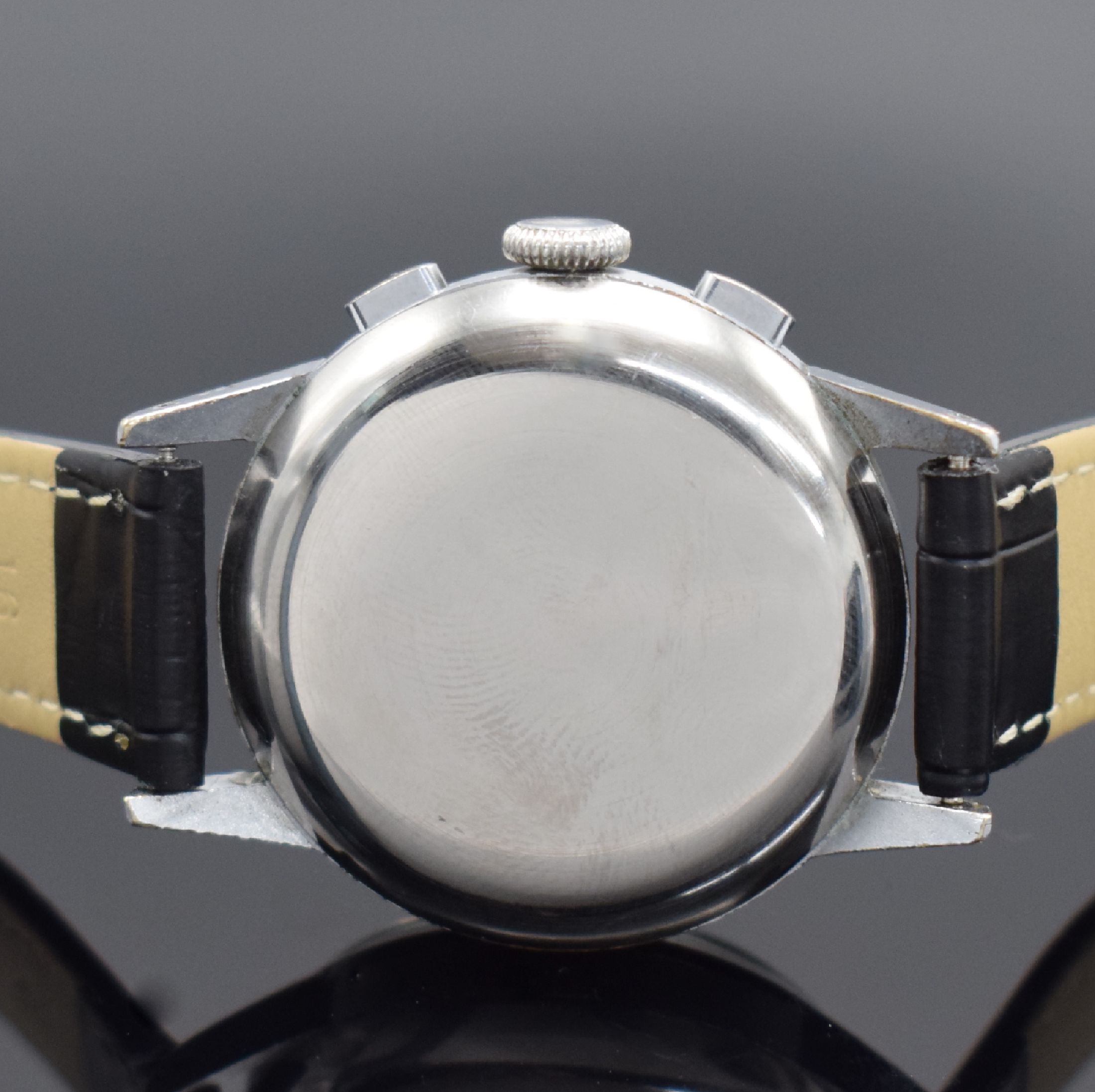Detail c: HUGEX Herrenchronograph mit Schaltrad, Schweiz um 1950, Handaufzug, verchr. Geh., Stahlboden aufgedr., silb. Zifferbl. fl., arab. Leuchtzahlen, gebl. ...