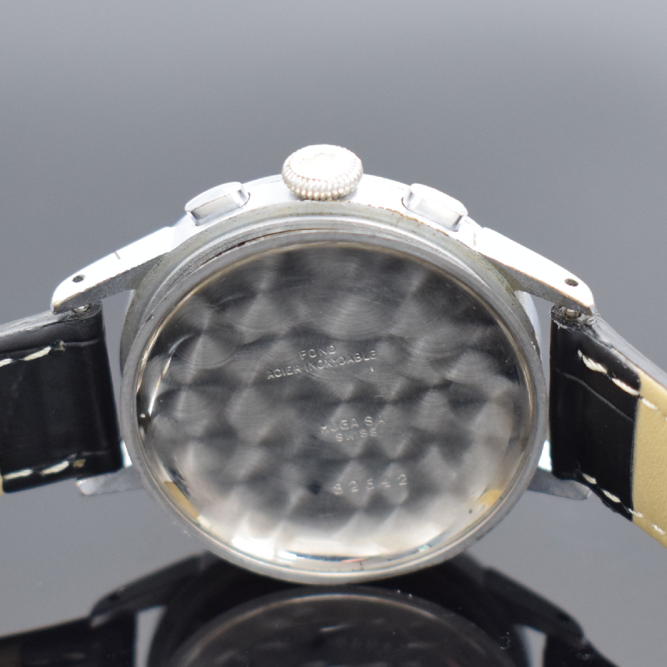 Detail e: HUGEX Herrenchronograph mit Schaltrad, Schweiz um 1950, Handaufzug, verchr. Geh., Stahlboden aufgedr., silb. Zifferbl. fl., arab. Leuchtzahlen, gebl. ...