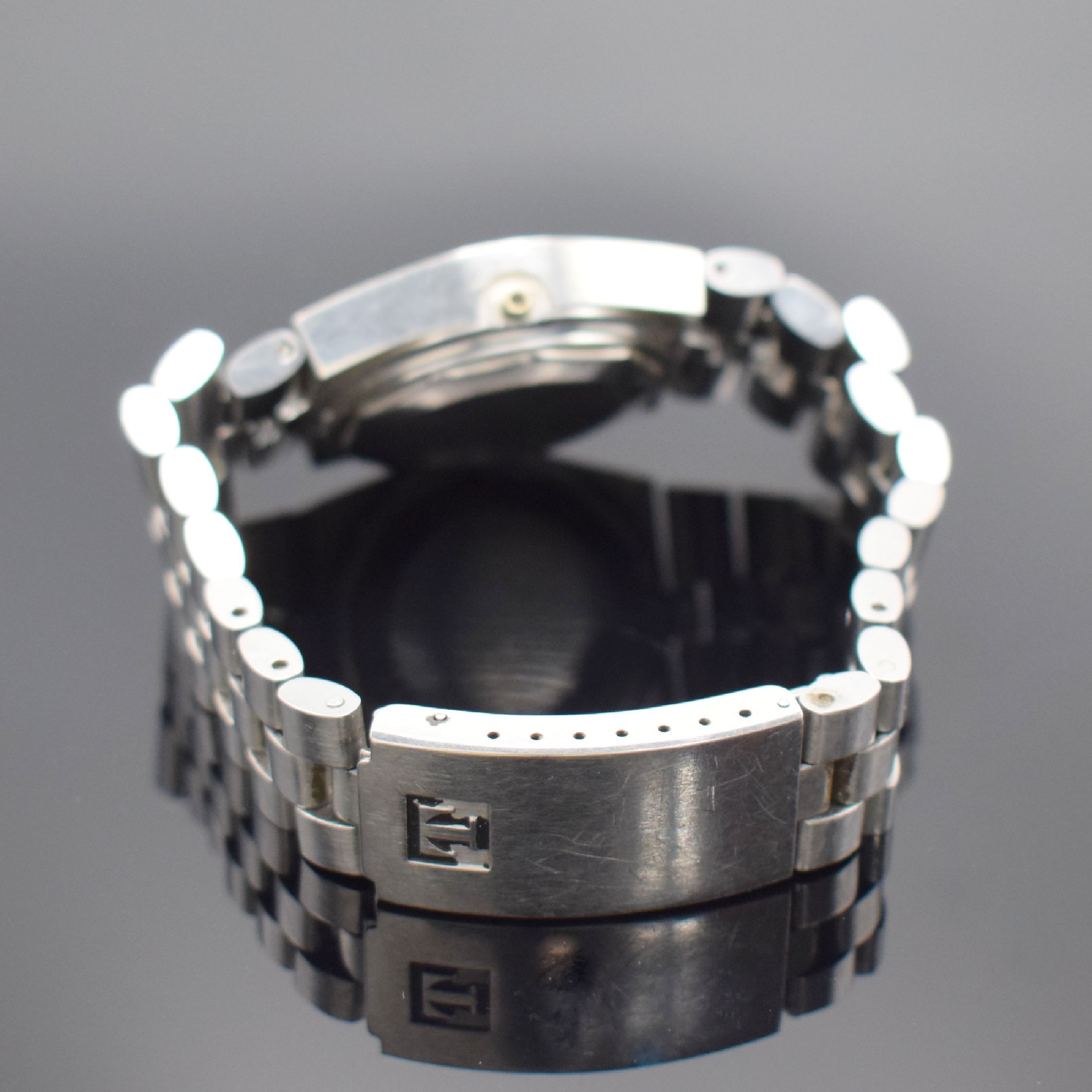 Detail b: TISSOT Herrenarmbanduhr PR 516 GL, Automatik, Schweiz um 1972, Edelstahlgeh. inkl. orig. Gliederband m. Faltschl., Boden verschr., Anz. v. Std., ...