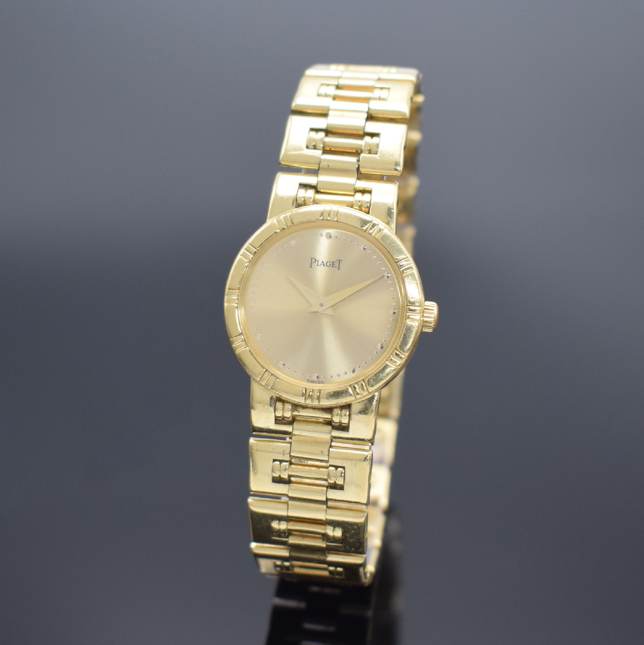 PIAGET Damenarmbanduhr in GG 750/000 Referenz 80563 K81, Schweiz um 1990, quarz, Boden 4- fach verschr., champagnerfarb. Zifferbl. m. gold. Std.-Ind. ...