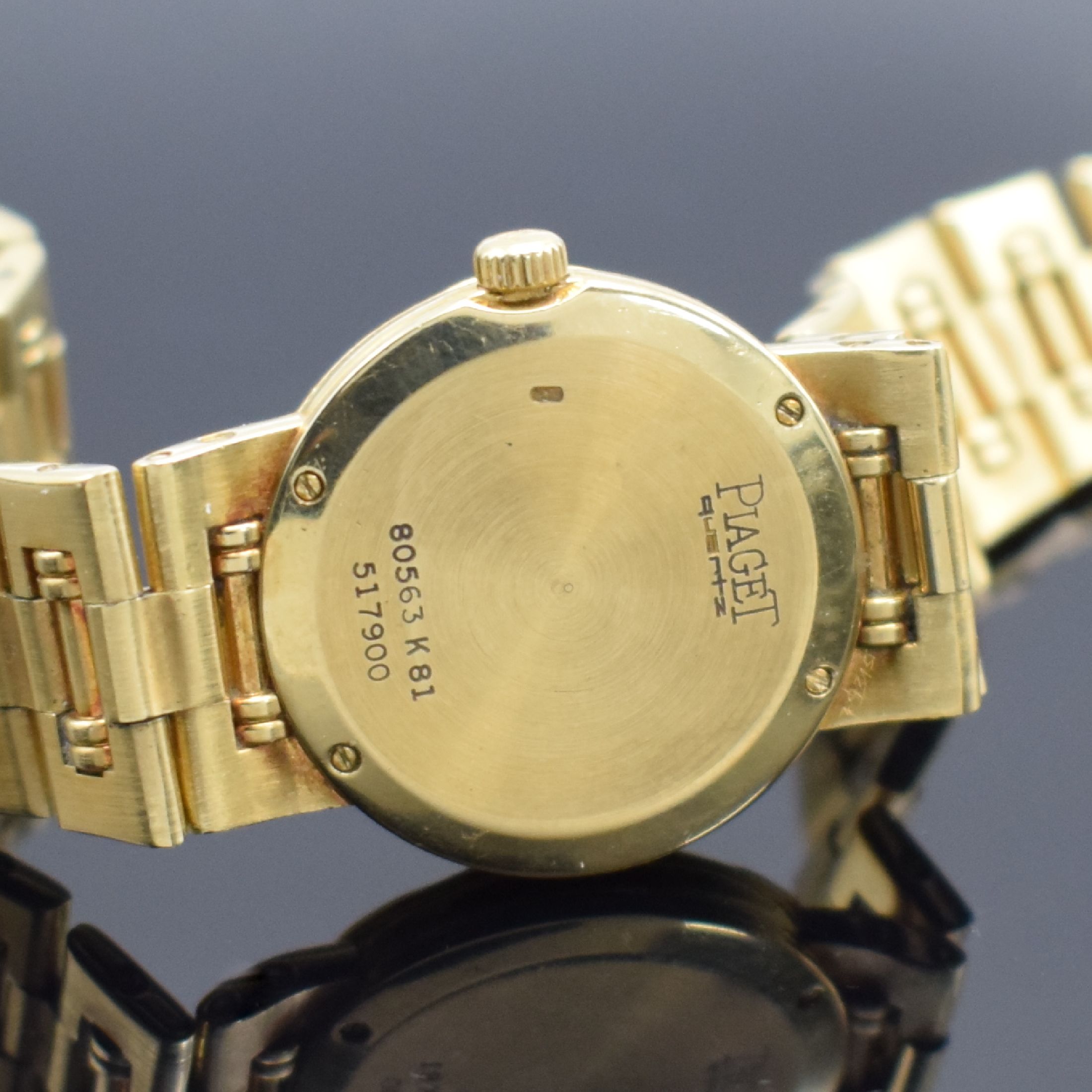 Detail e: PIAGET Damenarmbanduhr in GG 750/000 Referenz 80563 K81, Schweiz um 1990, quarz, Boden 4- fach verschr., champagnerfarb. Zifferbl. m. gold. Std.-Ind. ...