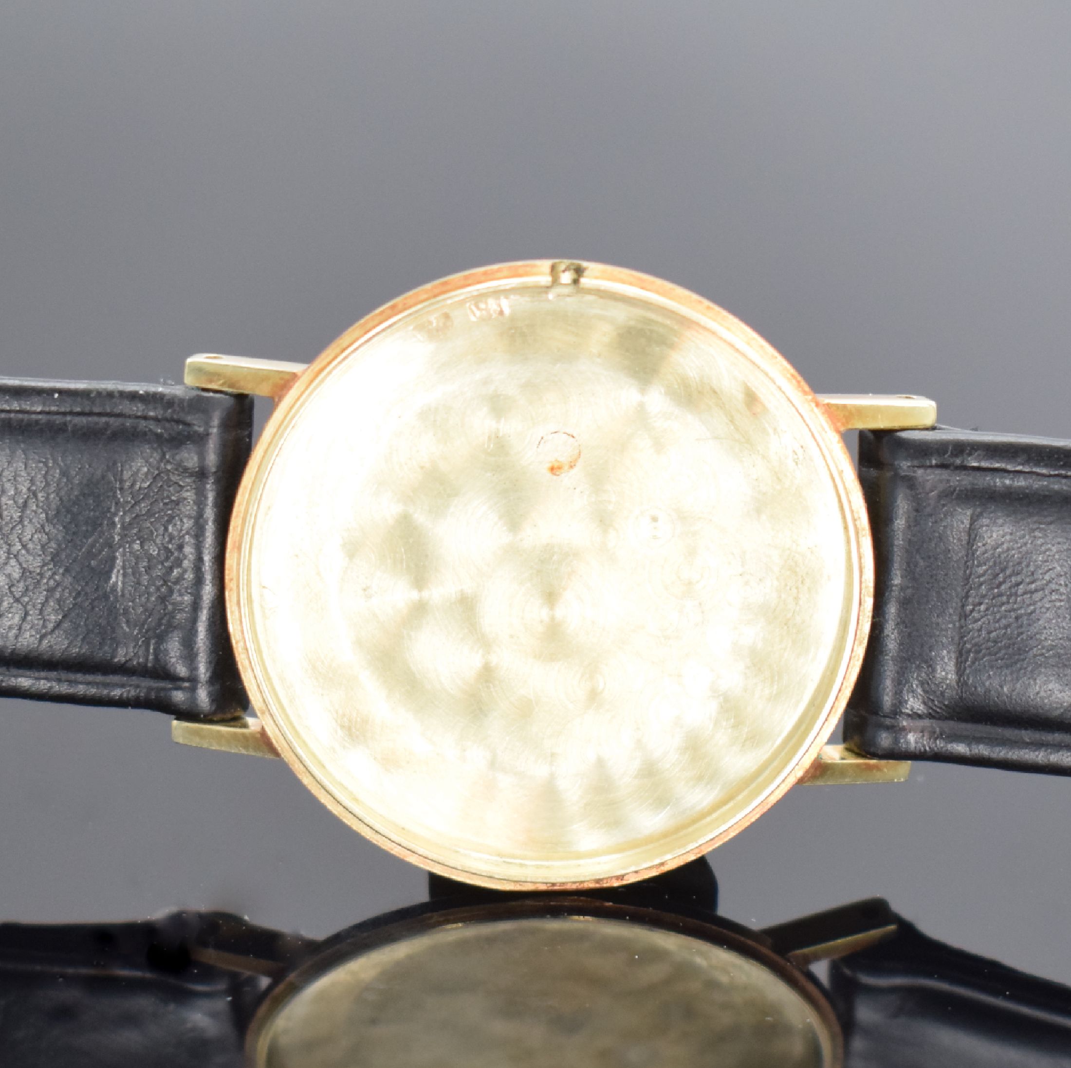 Detail e: LANCO Herrenarmbanduhr in GG 585/000, Schweiz um 1960, Handaufzug, 2-teil. Gehäuse, Boden aufgedr., silb. Zifferbl., gold. Zeiger, rotverg. Werk ...