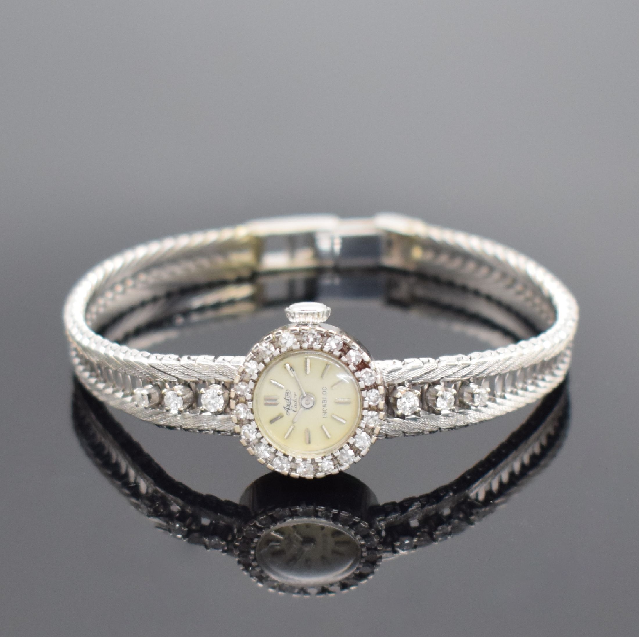 ARCTOS Damenarmbanduhr in WG 750/000 mit Diamanten, Schweiz um 1965, Handaufzug, Boden aufgedr., Lünette m. Diamanten bes., silb. Zifferbl. ...