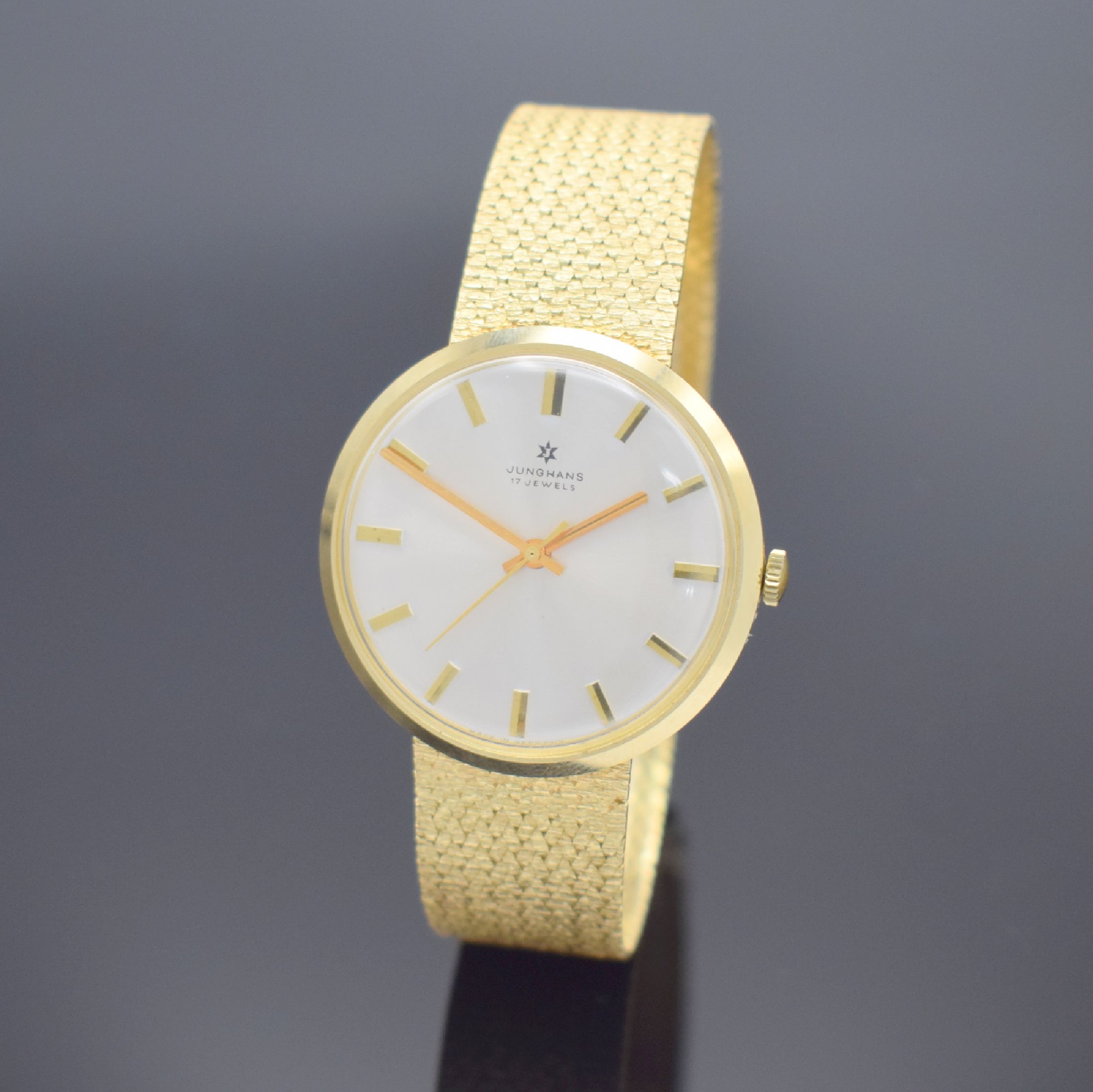 JUNGHANS Herrenarmbanduhr in GG 585/000, Deutschland verk. lt. beil. Garantie 05/1974, Handaufzug, Boden aufgedr., silb. Zifferbl. m. aufges. ...