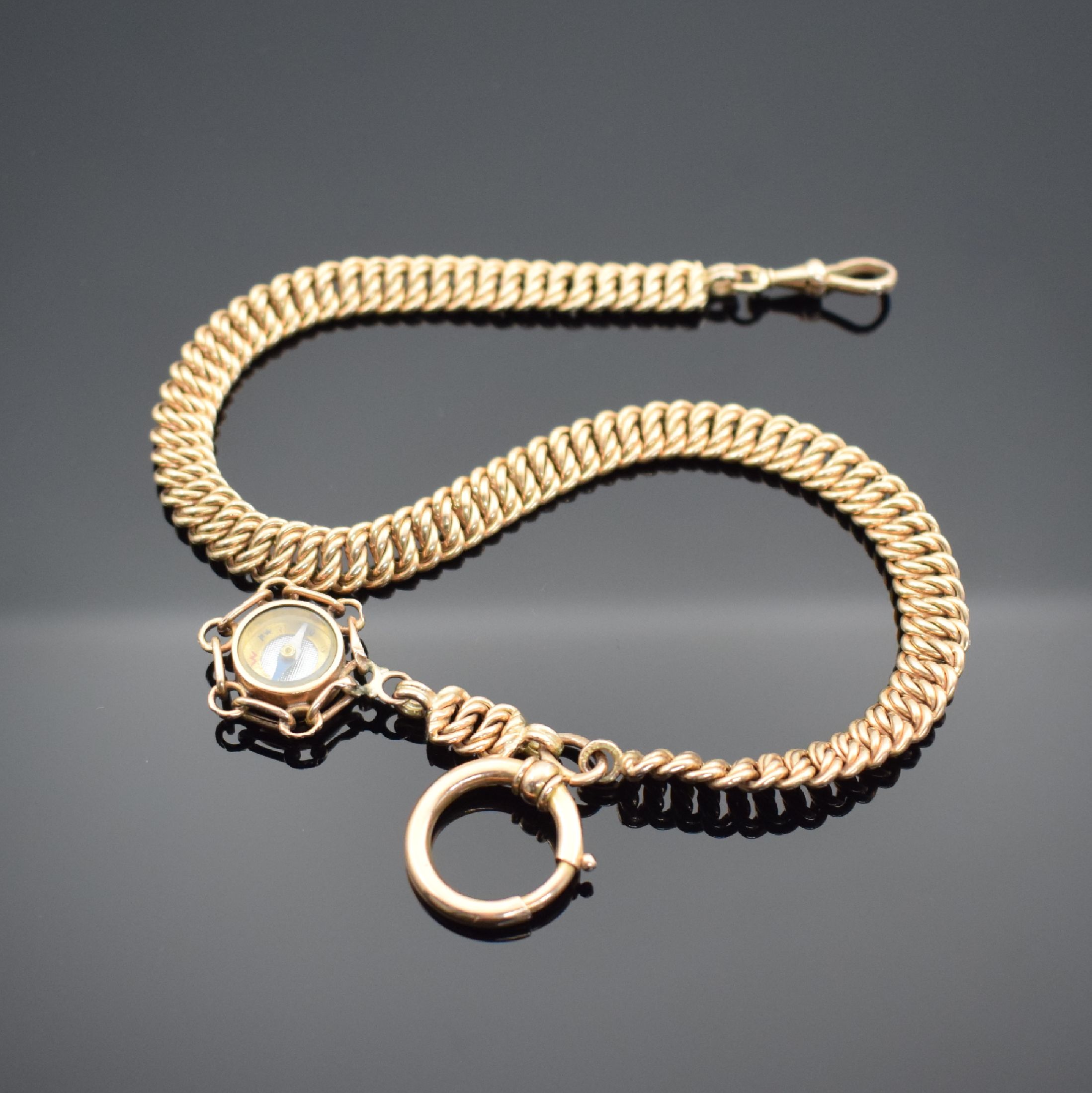 Taschenuhrkette in Gold 14k mit Kompass- Anhänger, um 1900, schöne geflochtene Kette m. Karabiner und Federring, leichter Verlauf, L. ca. 33 cm, ...