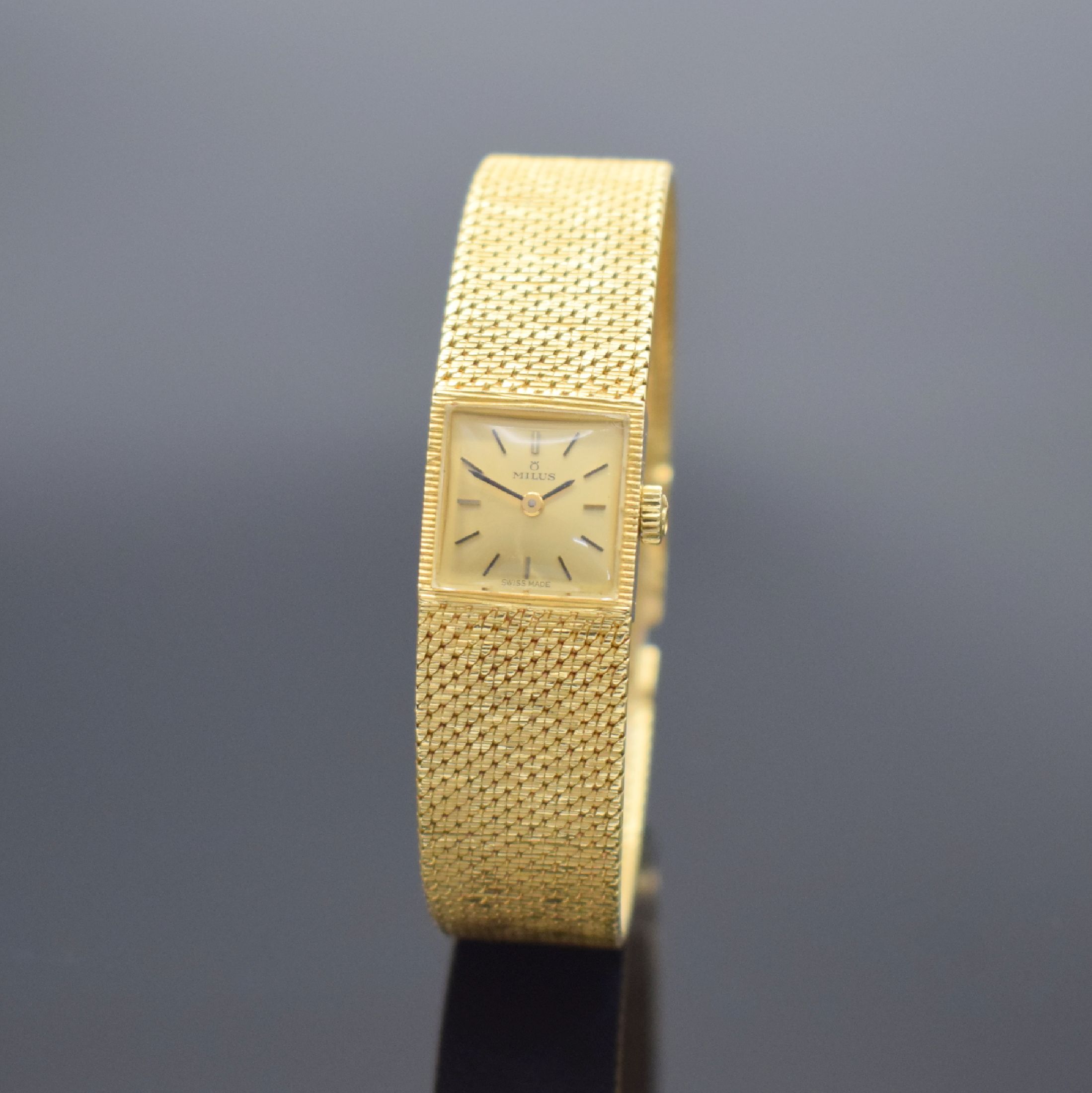 MILUS Damenarmbanduhr in GG 750/000, Schweiz um 1960, Handaufzug, Milanaiseband, Boden aufgedr., champagnerfarb. Zifferbl. m. aufgel. Std.-Ind., ...