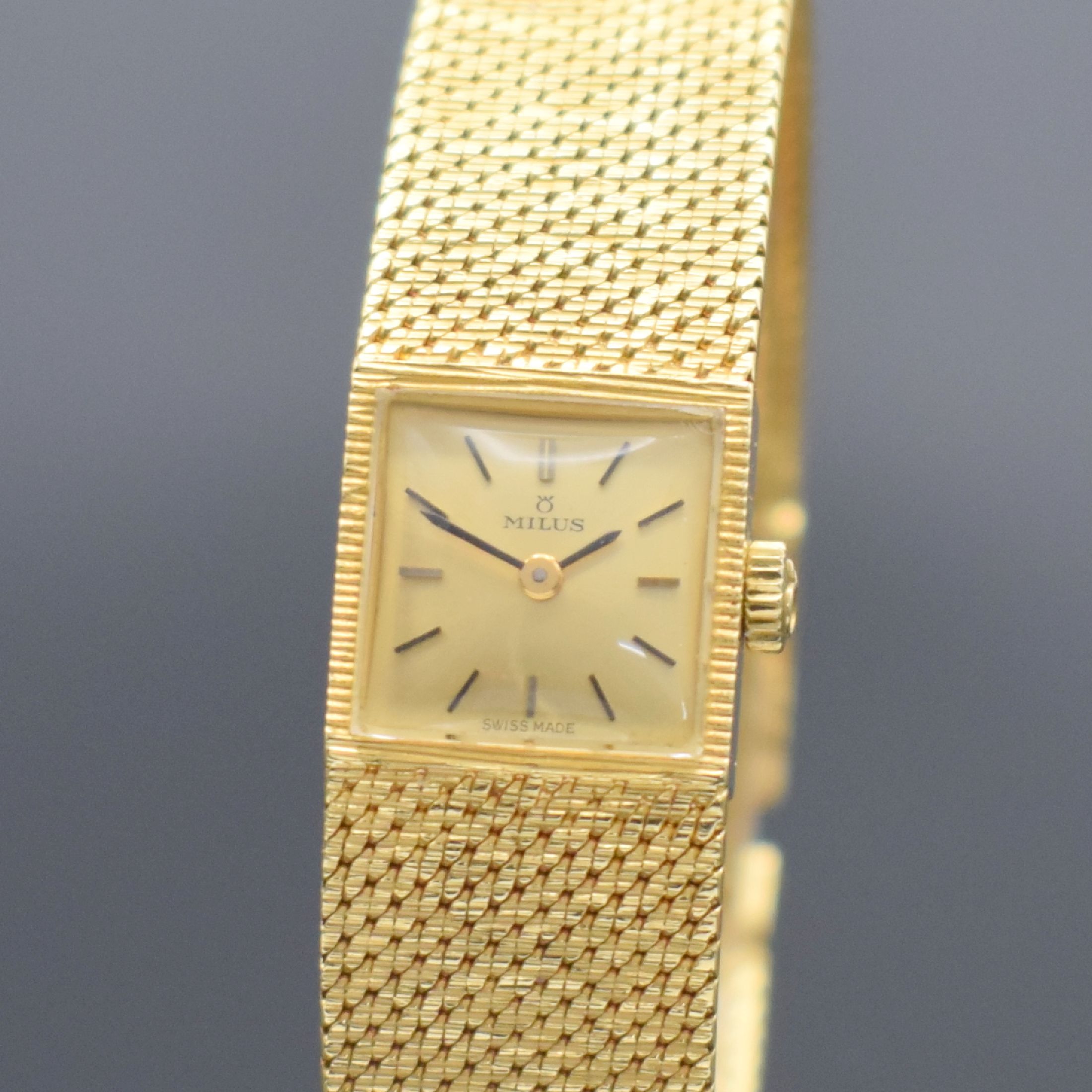 Detail a: MILUS Damenarmbanduhr in GG 750/000, Schweiz um 1960, Handaufzug, Milanaiseband, Boden aufgedr., champagnerfarb. Zifferbl. m. aufgel. Std.-Ind., ...