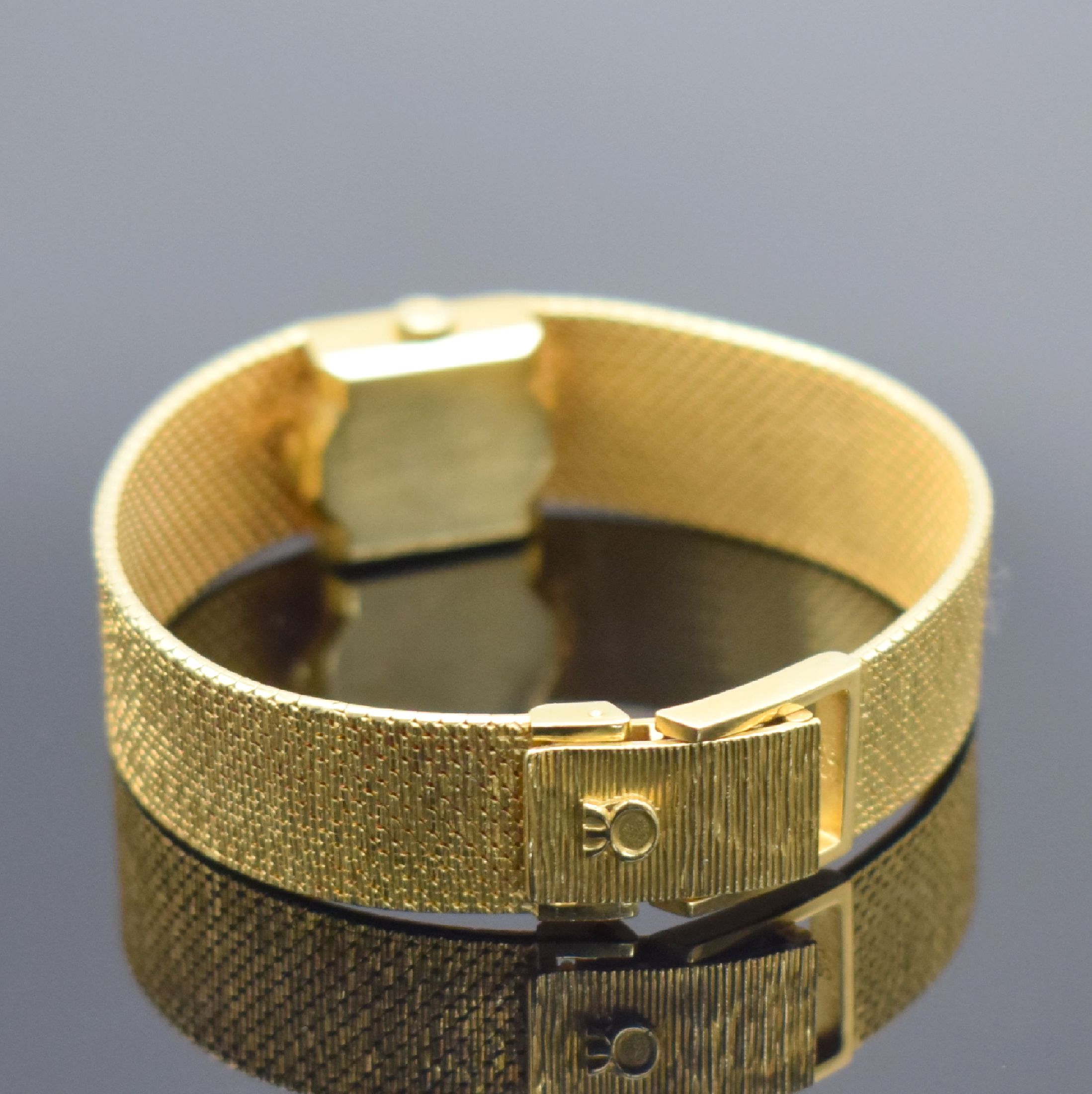 Detail b: MILUS Damenarmbanduhr in GG 750/000, Schweiz um 1960, Handaufzug, Milanaiseband, Boden aufgedr., champagnerfarb. Zifferbl. m. aufgel. Std.-Ind., ...