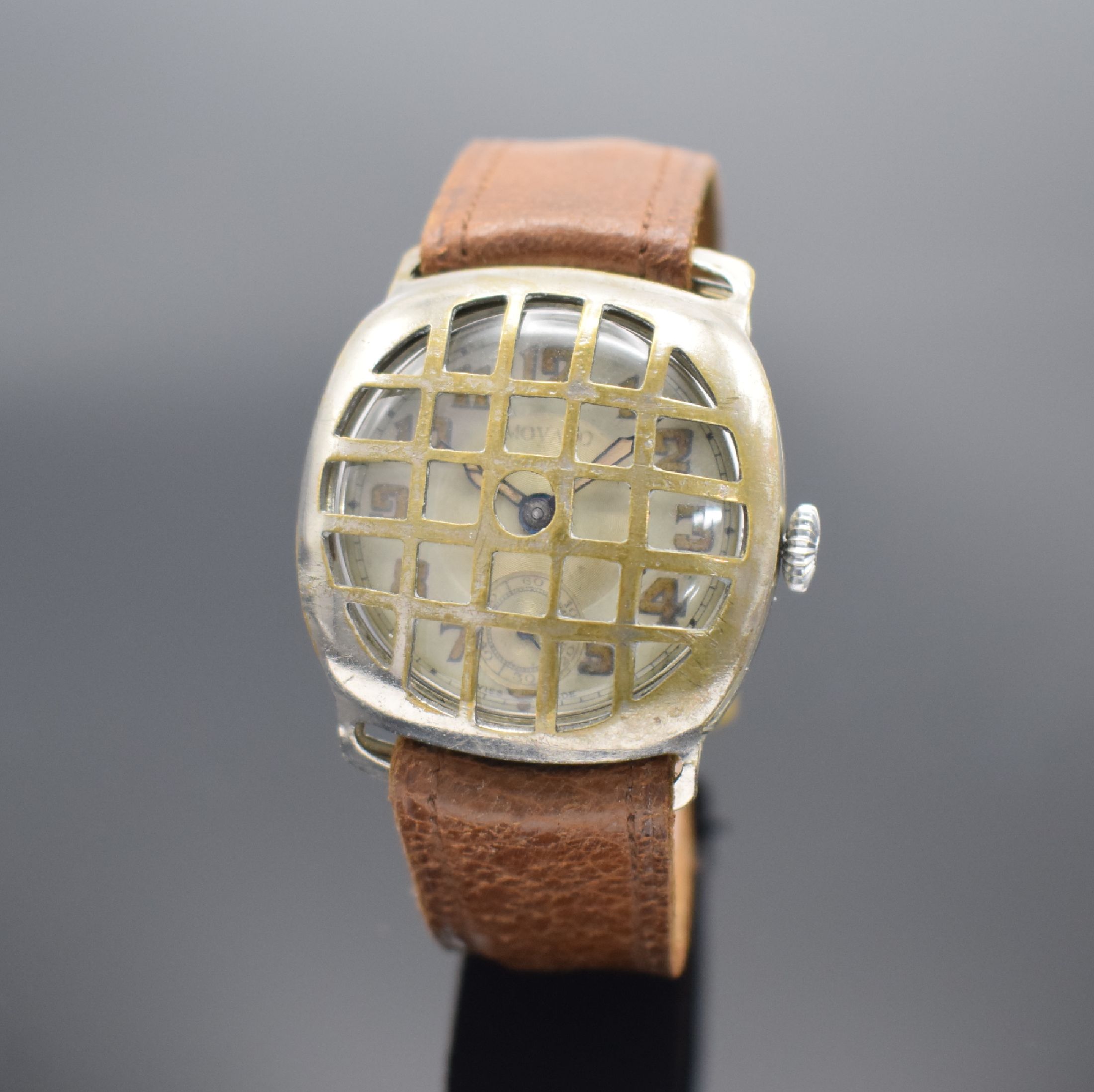 DOMINEX frühe Herrenarmbanduhr in Nickel sogenannte Schützengrabenuhr, Schweiz um 1915, Handaufzug, Boden aufgedr., silb. Duoton-Zifferbl. mit ...