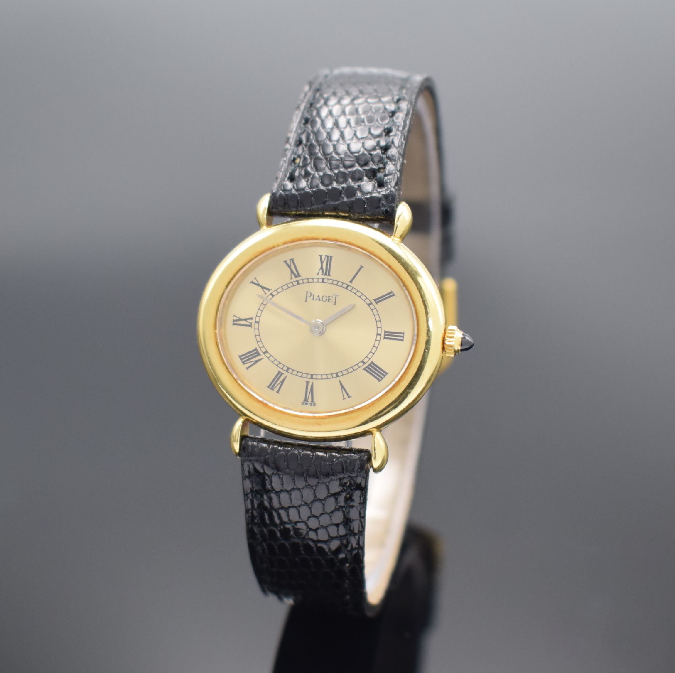 PIAGET Damenarmbanduhr in GG 750/000 Referenz 98120, Schweiz um 1980, Handaufzug, 2-teil. Gehäuse, Boden verschr., gold. Zifferbl. m. röm. Zahlen, ...