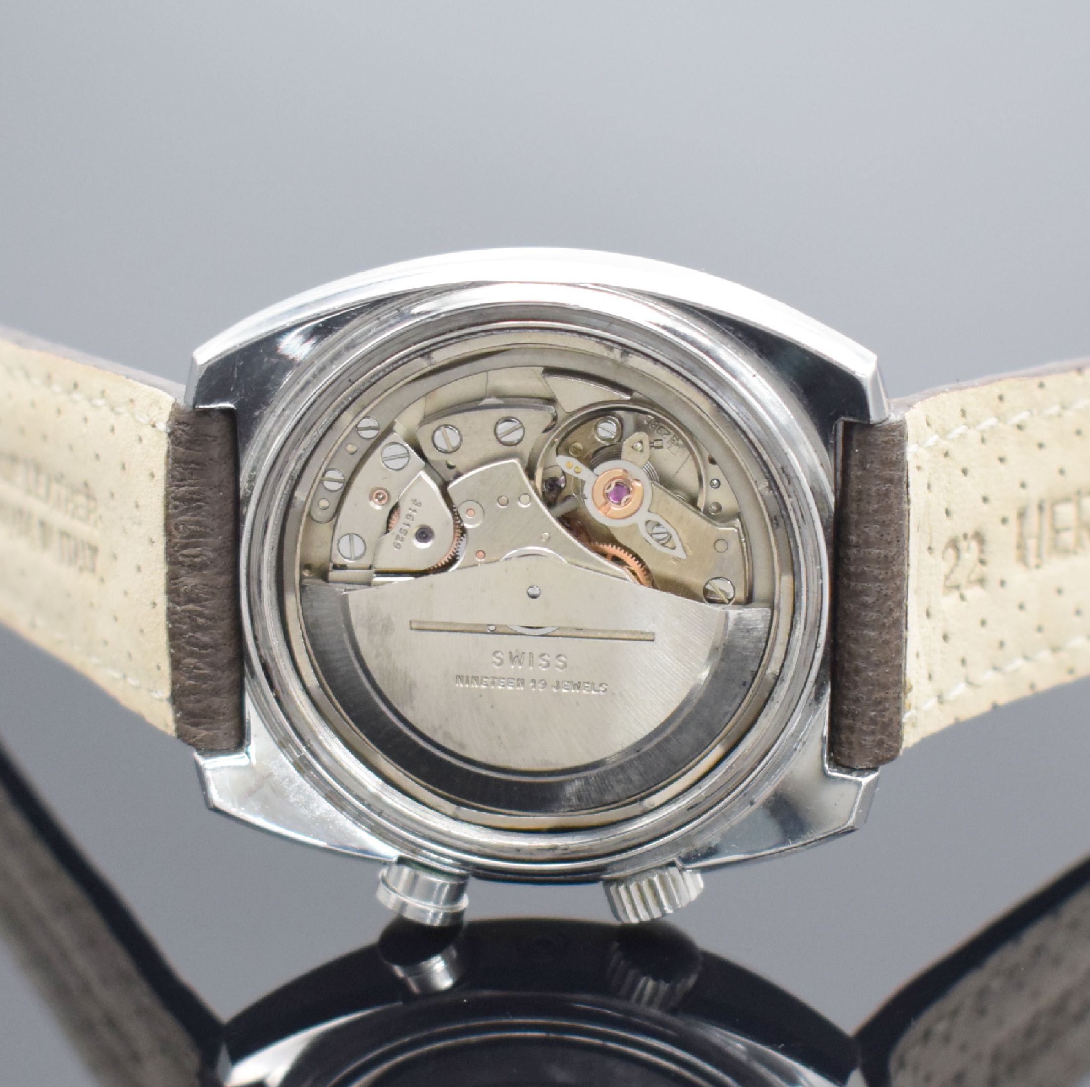 Detail e: LEMANIA Armbandwecker in Stahl, Schweiz um 1970, Automatik, tonneauförm. Geh., Boden geschr., silb. Zifferbl. m. aufges. Std.-Ind., schwarze Zeiger, ...