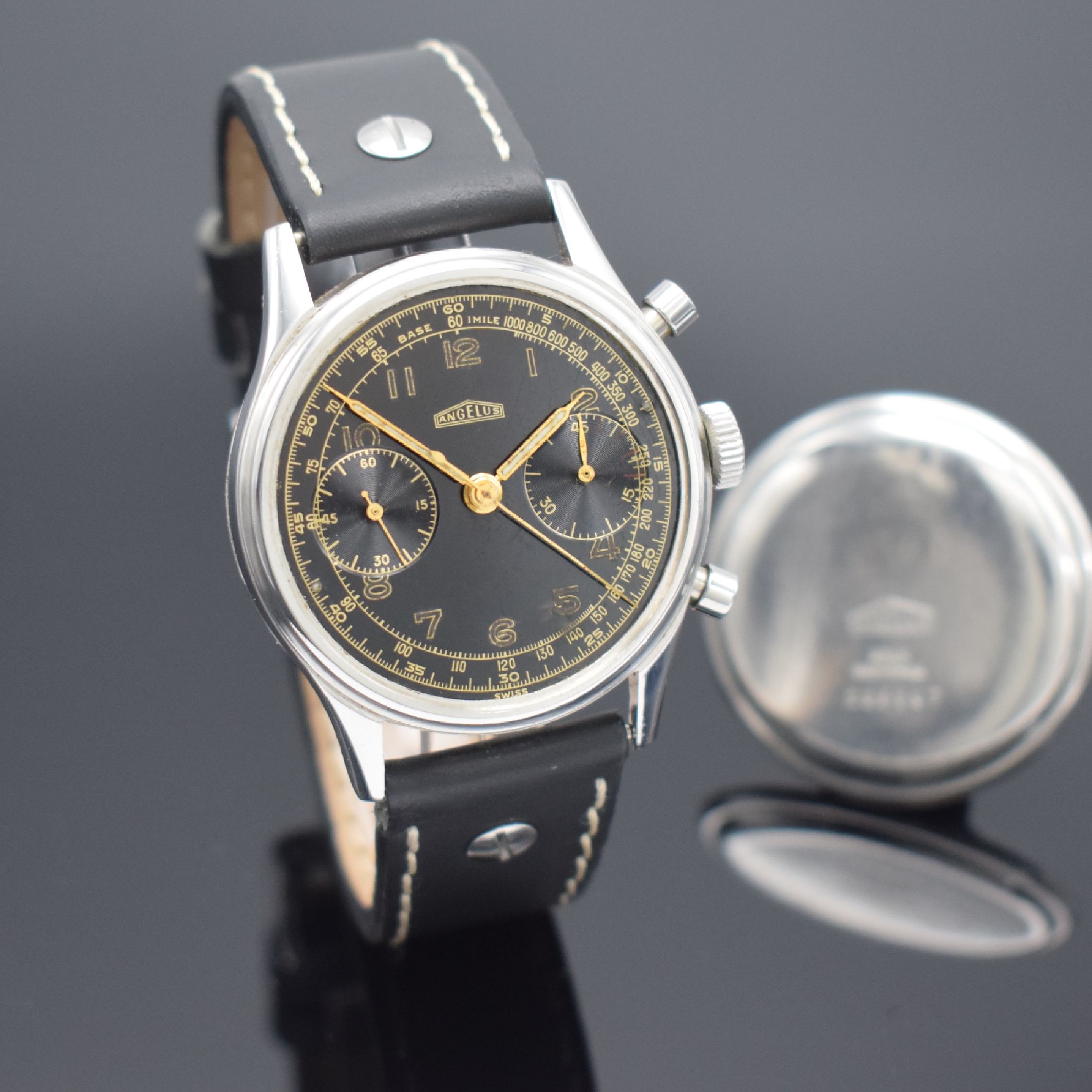 Detail e: ANGELUS Schaltradchronograph in Stahl & zusätzlicher verglaster Stahlboden, Schweiz um 1945, Handaufzug, beids. vergl. Geh., Boden aufgedr., ...