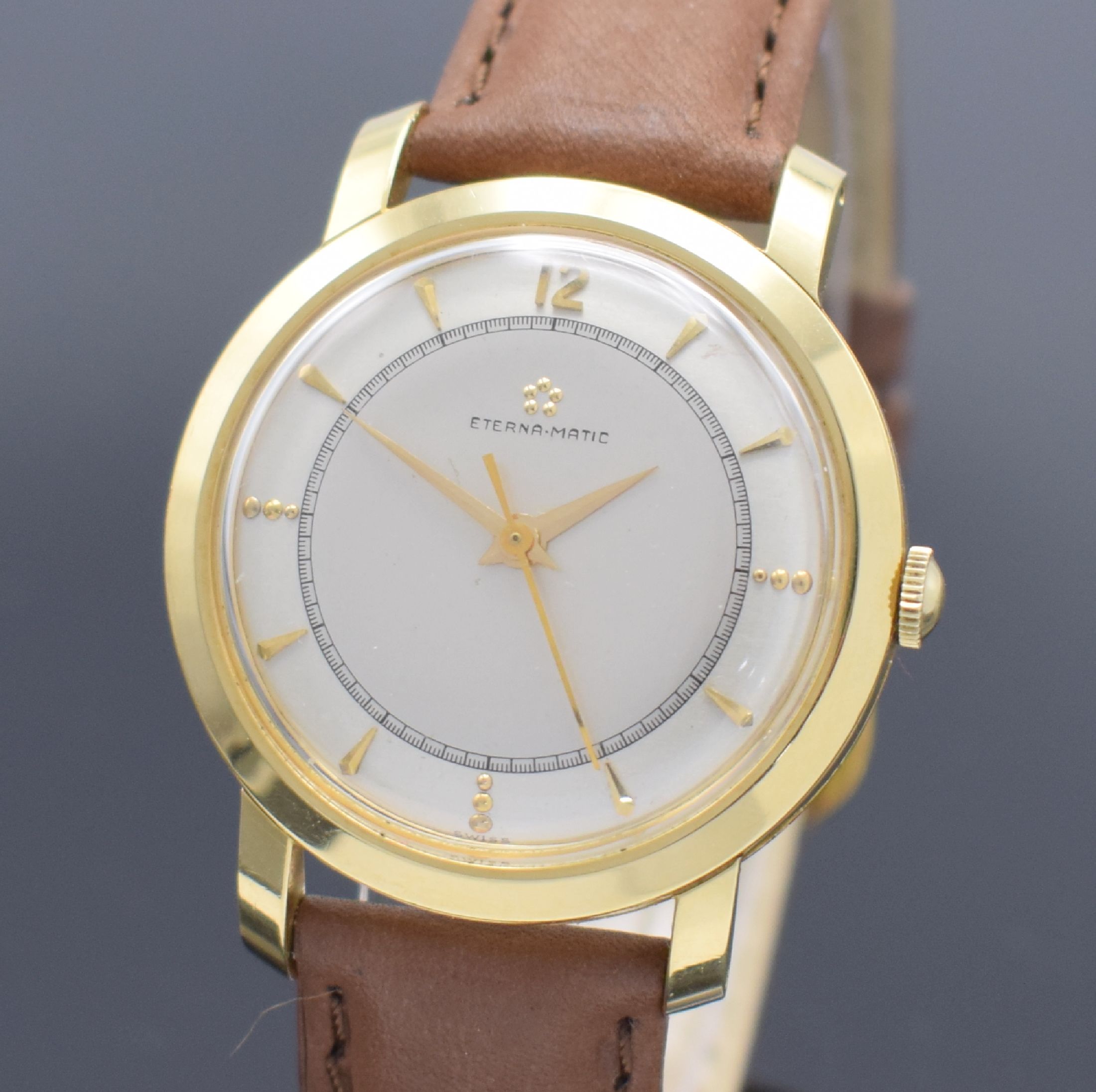Detail a: ETERNA-MATIC Herrenarmbanduhr in GG 750/000, Schweiz um 1955, Automatik, 3-teil. Gehäuse, Boden & Glasrand aufgedr., silb. Duoton- Zifferbl. m. ...