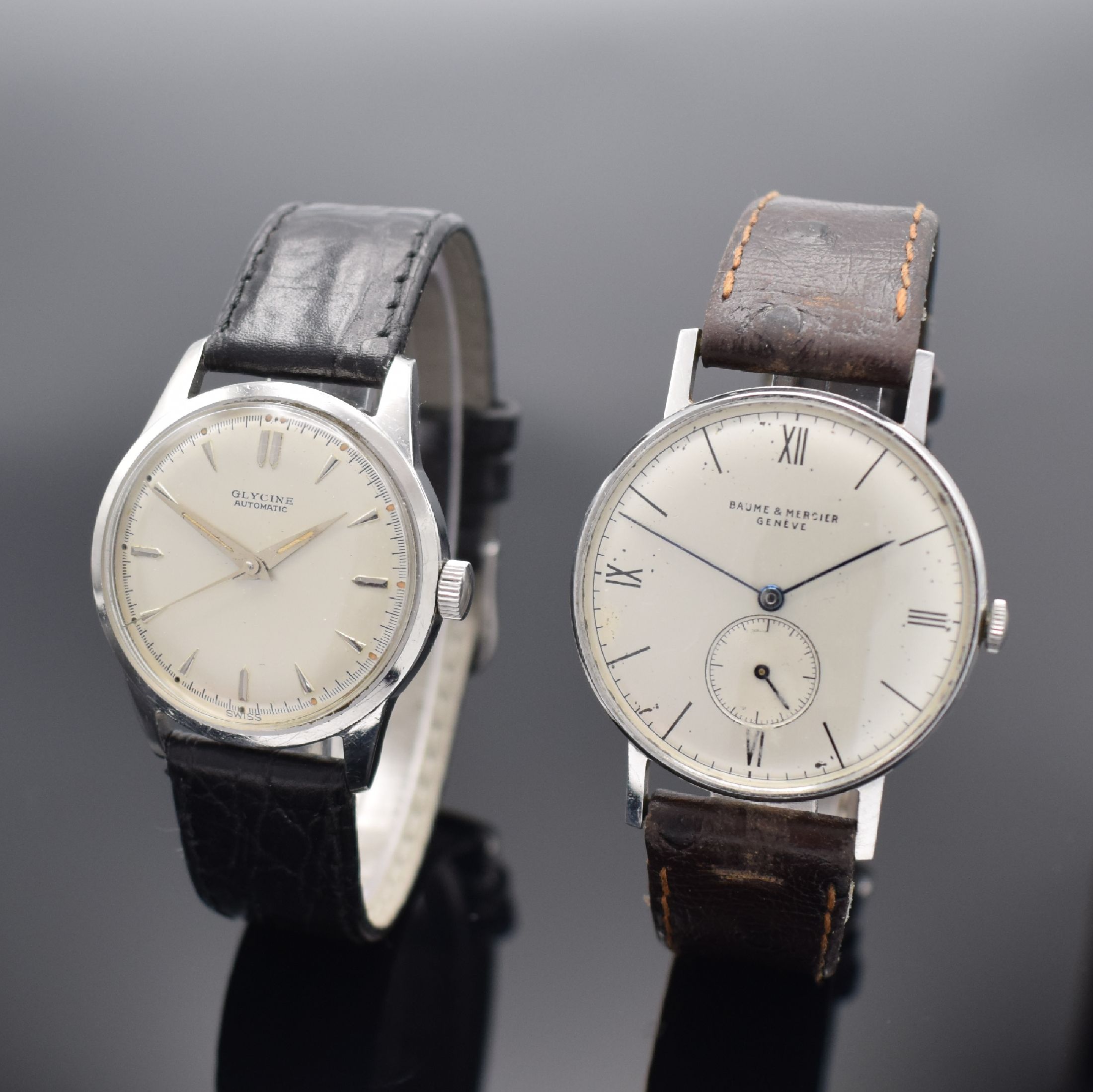 GLYCINE & BAUME MERCIER 2 Herrenarmbanduhren in Stahl, Schweiz, 1) Baume & Mercier um 1940, Boden aufgedr., silb. Zifferbl. fl., gebl. Zeiger, Kal. ...