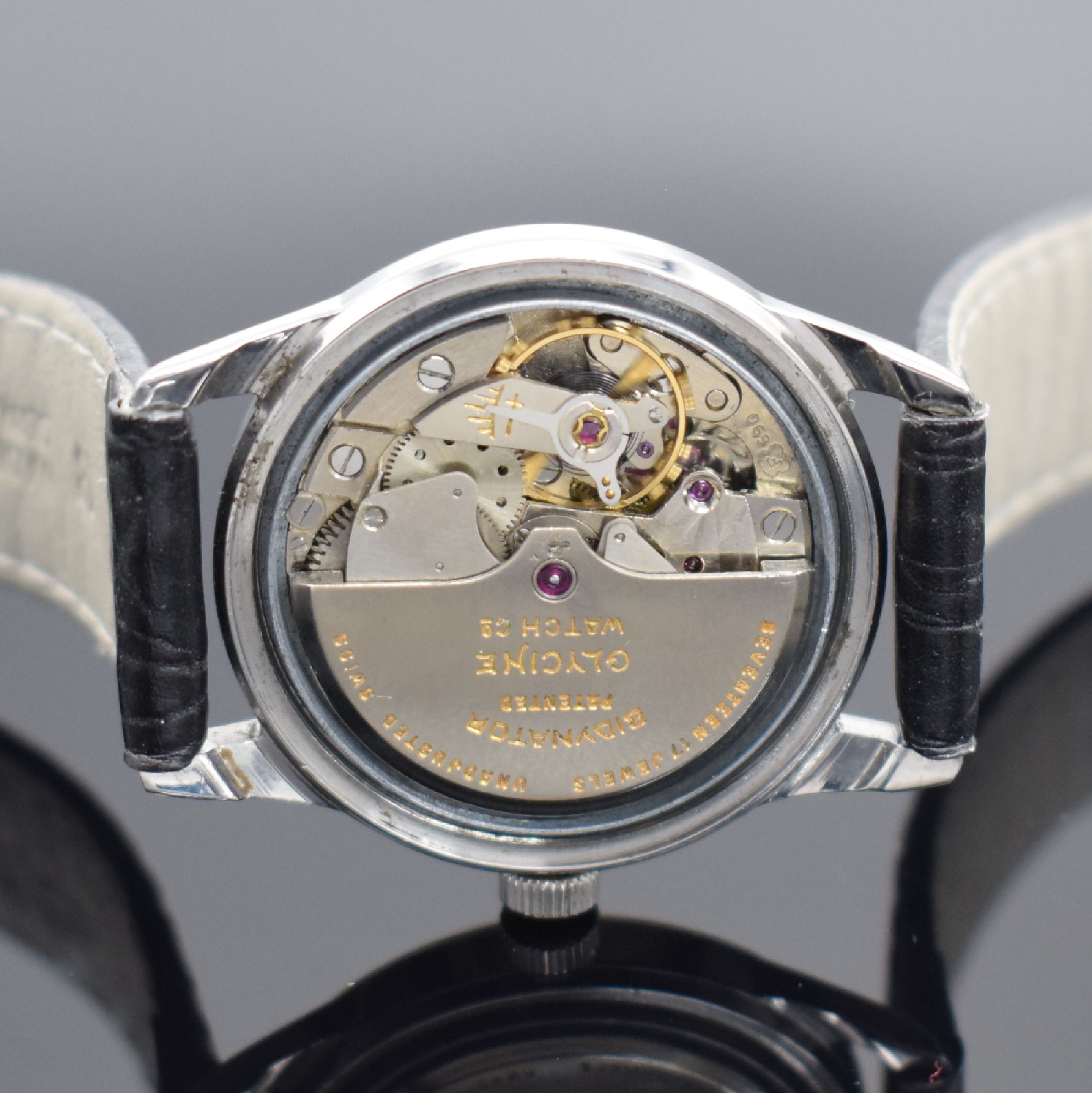 Detail d: GLYCINE & BAUME MERCIER 2 Herrenarmbanduhren in Stahl, Schweiz, 1) Baume & Mercier um 1940, Boden aufgedr., silb. Zifferbl. fl., gebl. Zeiger, Kal. ...