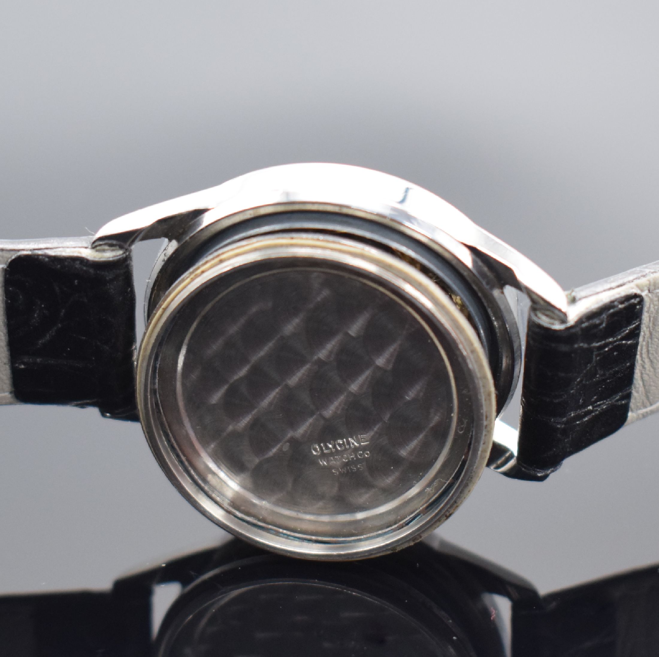 Detail e: GLYCINE & BAUME MERCIER 2 Herrenarmbanduhren in Stahl, Schweiz, 1) Baume & Mercier um 1940, Boden aufgedr., silb. Zifferbl. fl., gebl. Zeiger, Kal. ...
