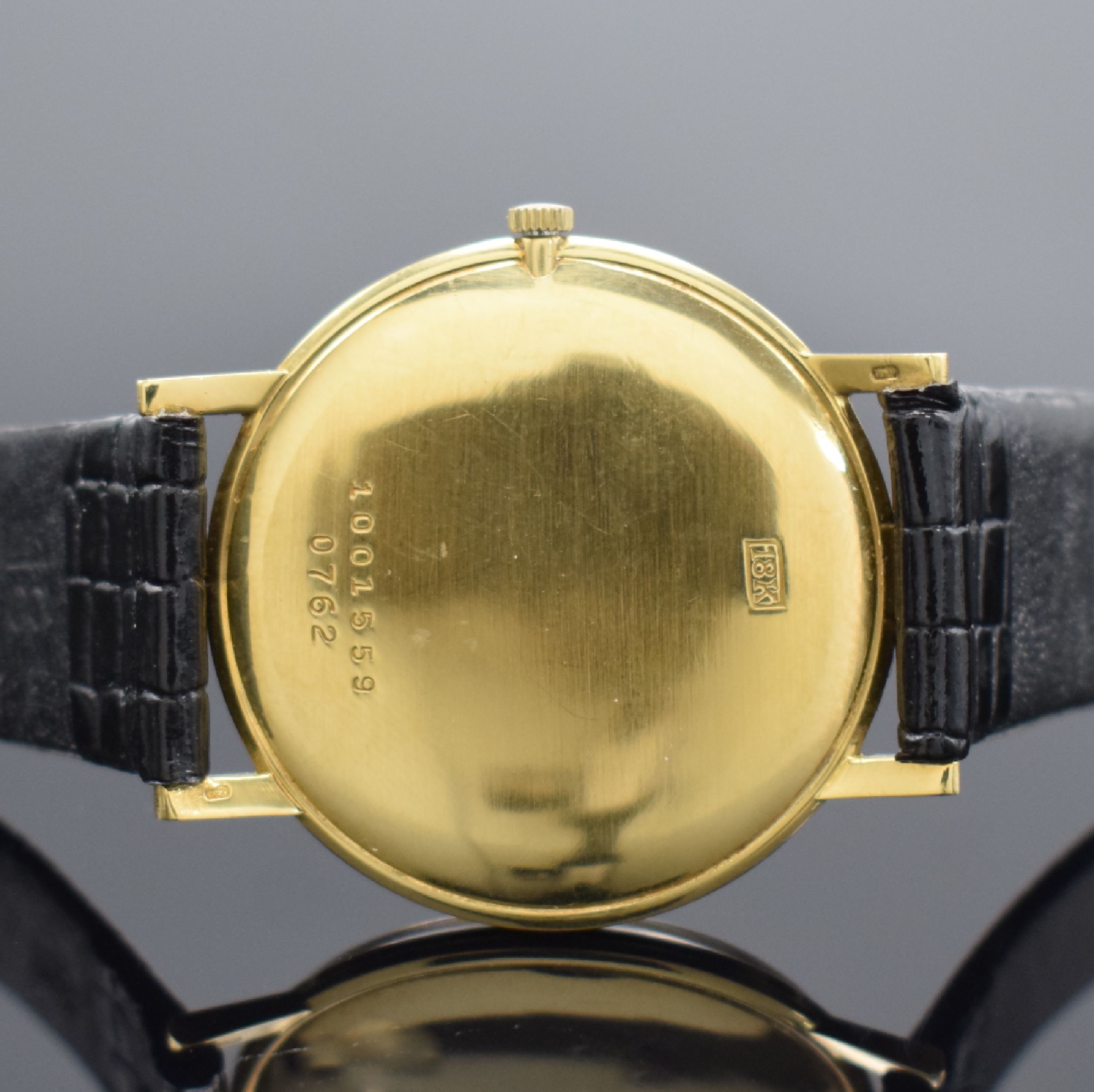 Detail c: DE GREEF Herrenarmbanduhr in GG 750/000, Schweiz um 1960, Handaufzug, 2-teil. Geh., Boden gedr., silb. Zifferbl. m. aufges. Std.- Ind., gold. Zeiger, ...