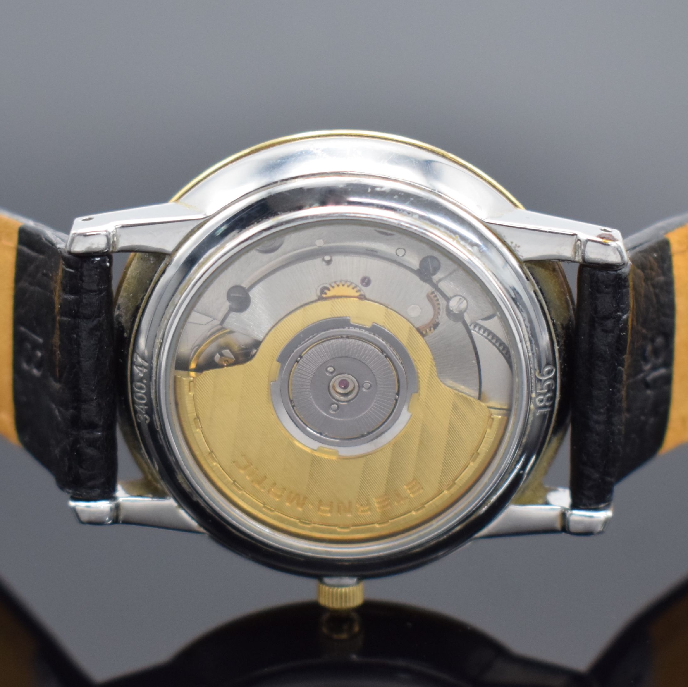 Detail d: ETERNA-MATIC 1856 Herrenarmbanduhr in Stahl/Gold, Schweiz um 1995, Automatik, beids. vergl. Geh., Boden aufgedr., weißes Zifferbl. m. gold. ...