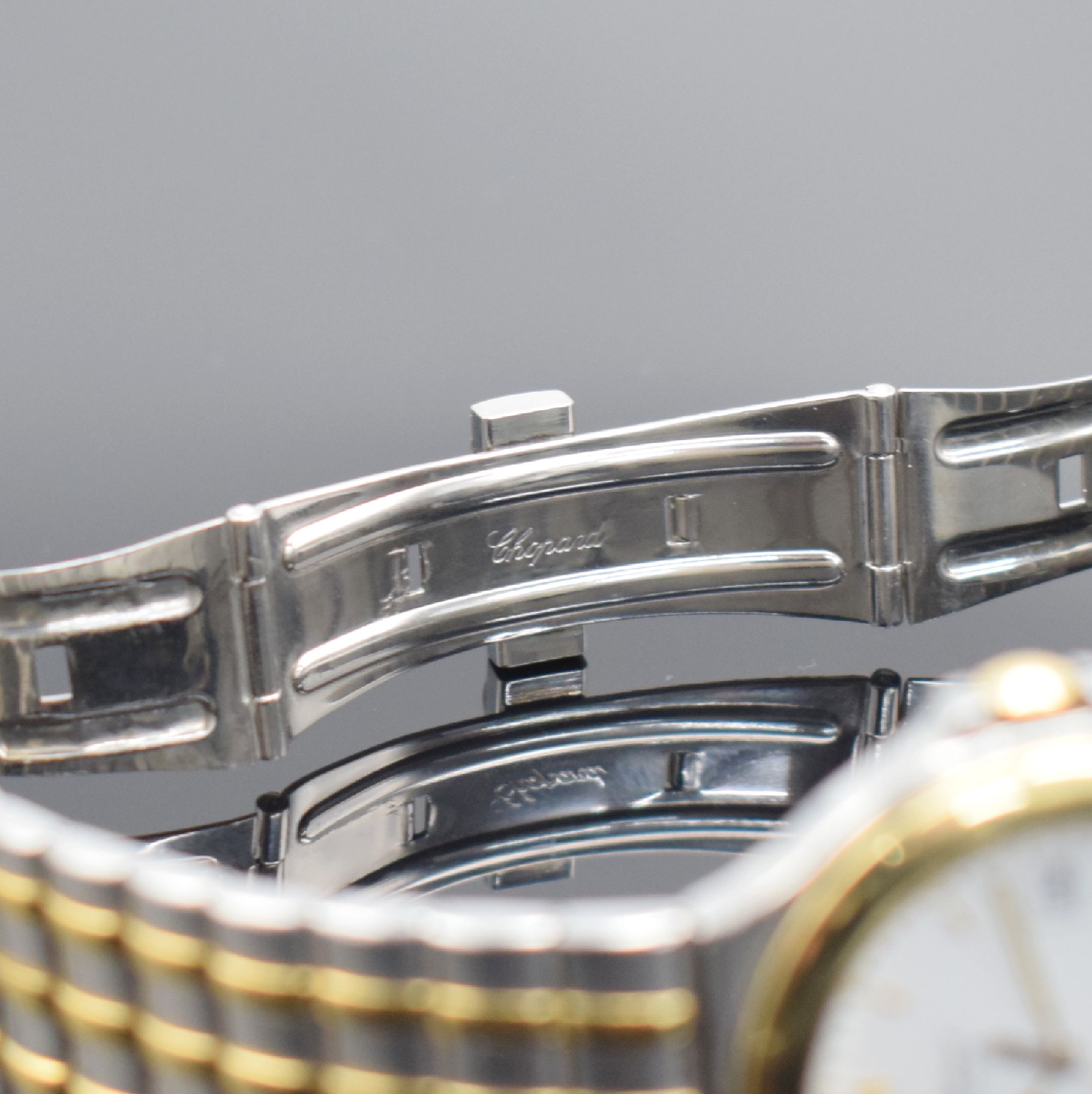 Detail c: CHOPARD Herrenarmbanduhr Monte Carlo in Stahl/Gold Referenz 8110, Schweiz um 1995, quarz, Lünette gegen Boden 8-fach verschr., orig. Gliederband m. ...