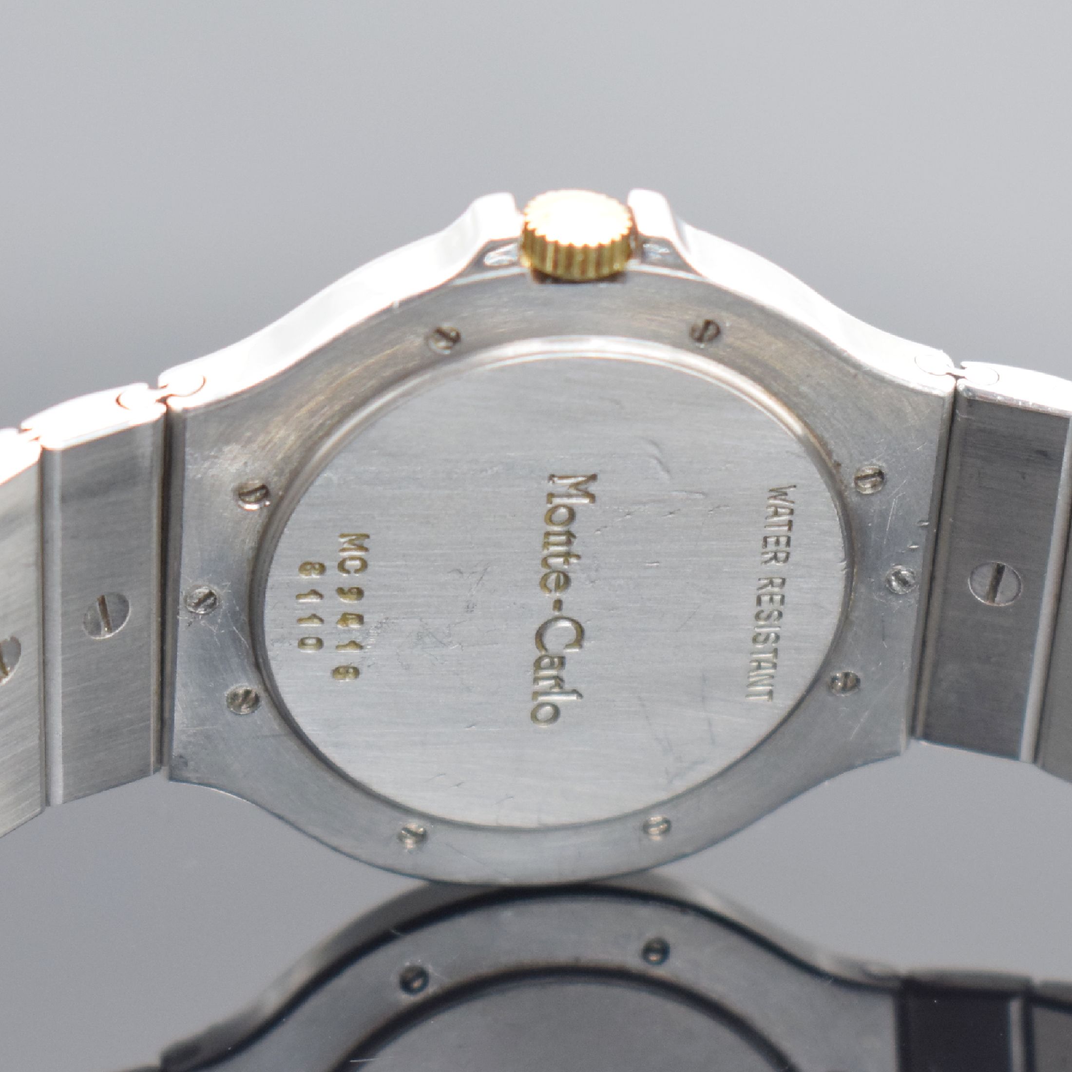Detail d: CHOPARD Herrenarmbanduhr Monte Carlo in Stahl/Gold Referenz 8110, Schweiz um 1995, quarz, Lünette gegen Boden 8-fach verschr., orig. Gliederband m. ...