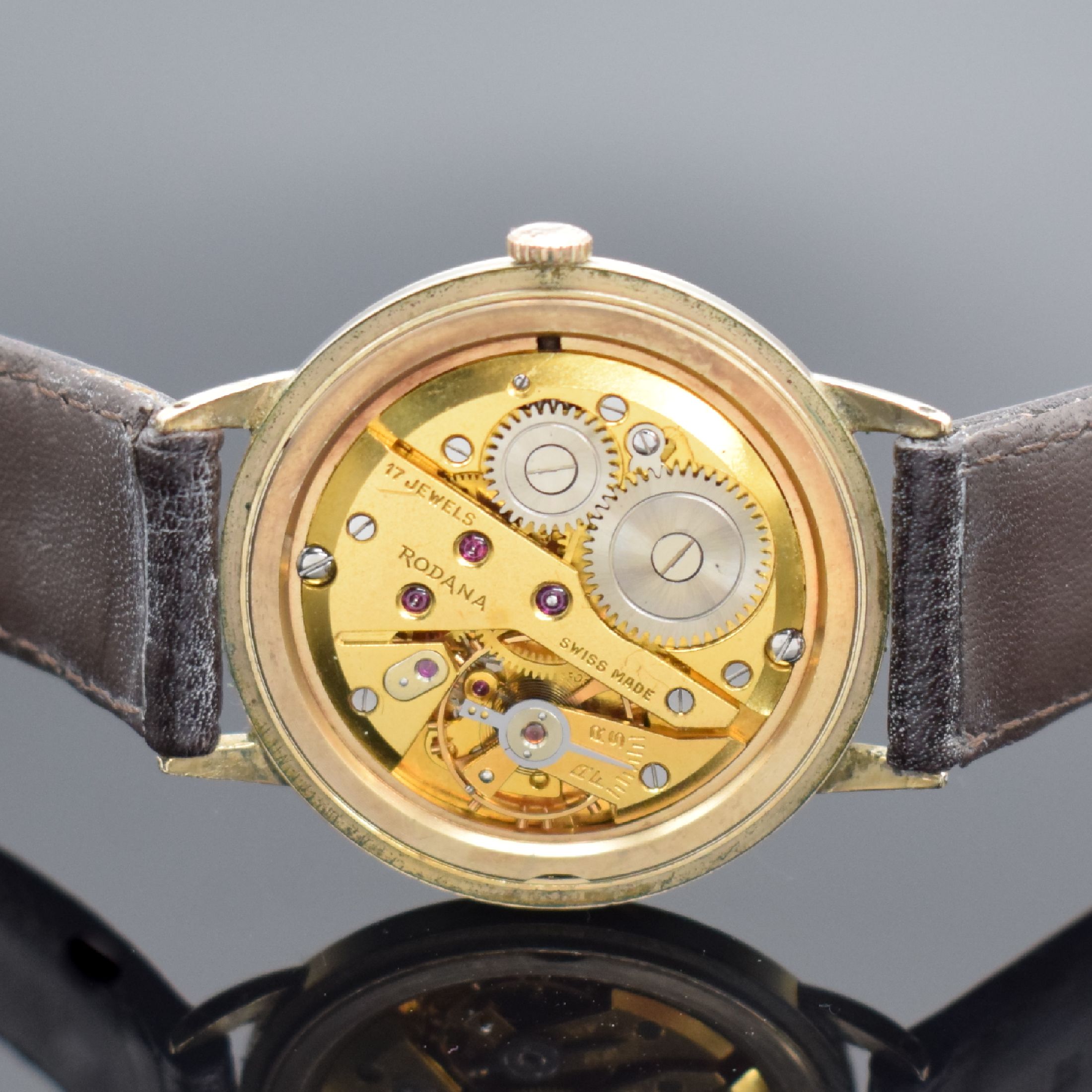 Detail d: RODANA De Luxe gold filled Herrenarmbanduhr, Schweiz um 1960, Handaufzug, Boden aufgedr., silb. Zifferbl. pat./fl., gold. Std.-Ind. & arab. Zahlen, ...