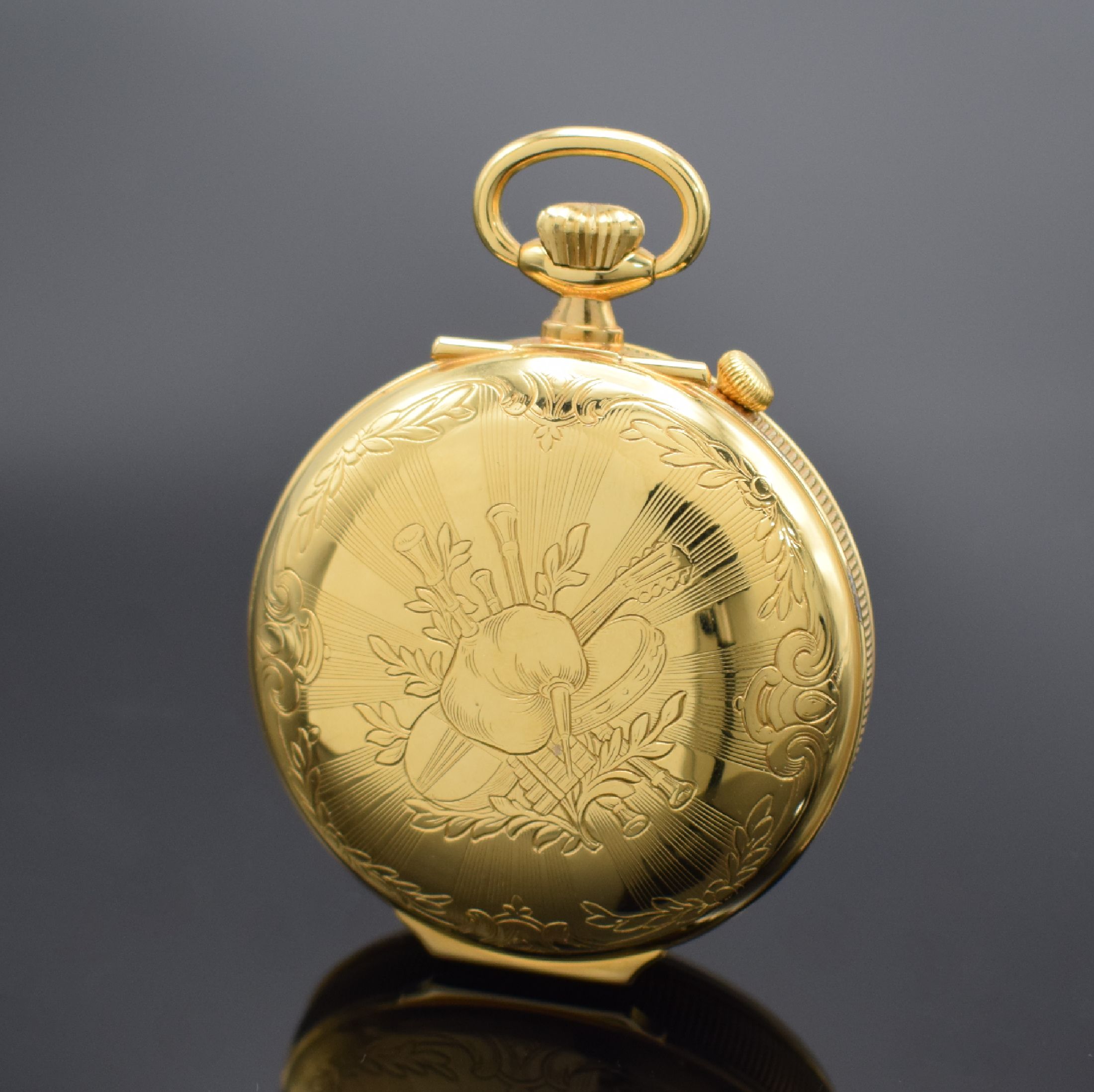 Detail b: REUGE vergoldete Taschenuhr mit Wecker- Spieluhr, Schweiz um 1985, aufstellbarer Rückdeckel m. Musikinstrumenten grav., Rand geriffelt, Zifferbl. m. ...