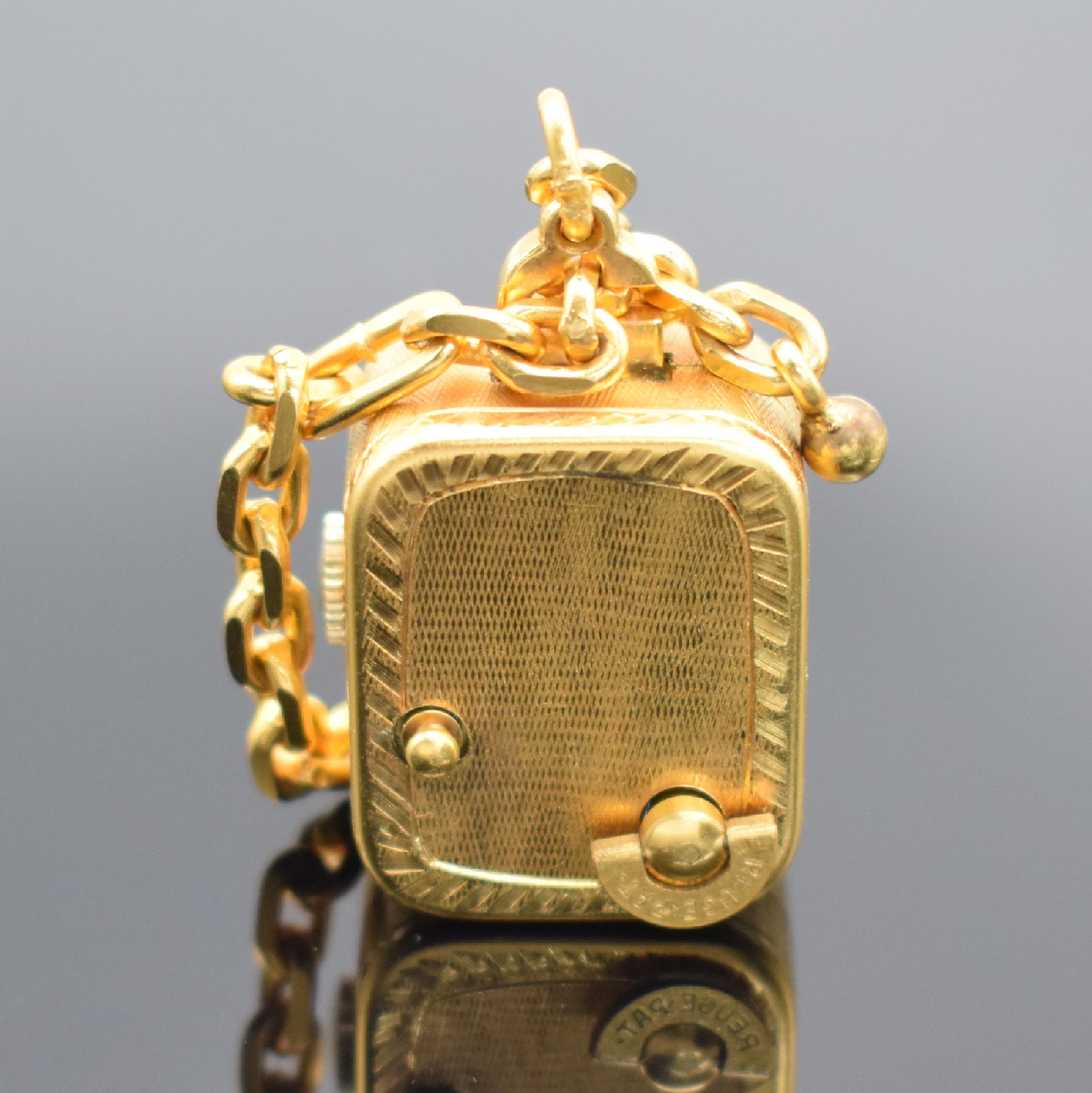 Detail b: REUGE Miniaturspieluhr an Kette, Schweiz um 1960, Handaufzug, verg. strukt. Geh., gedr., vorderseitig einges. Uhr, silb. Zifferbl. m. gold. Zeiger & ...