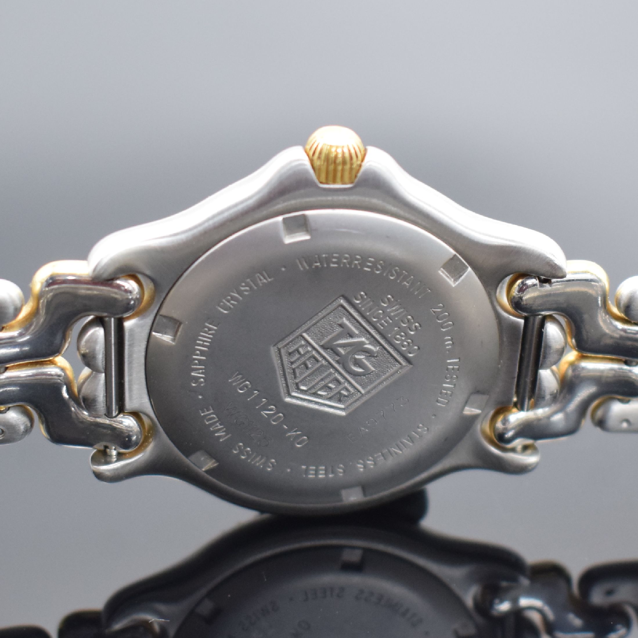 Detail d: TAG HEUER Professional Referenz WG1120, Schweiz um 1990, quarz, z. T. verg. Edelstahlgeh. inkl. Gliederband m. Faltschl., Boden & Krone verschr., ab ...
