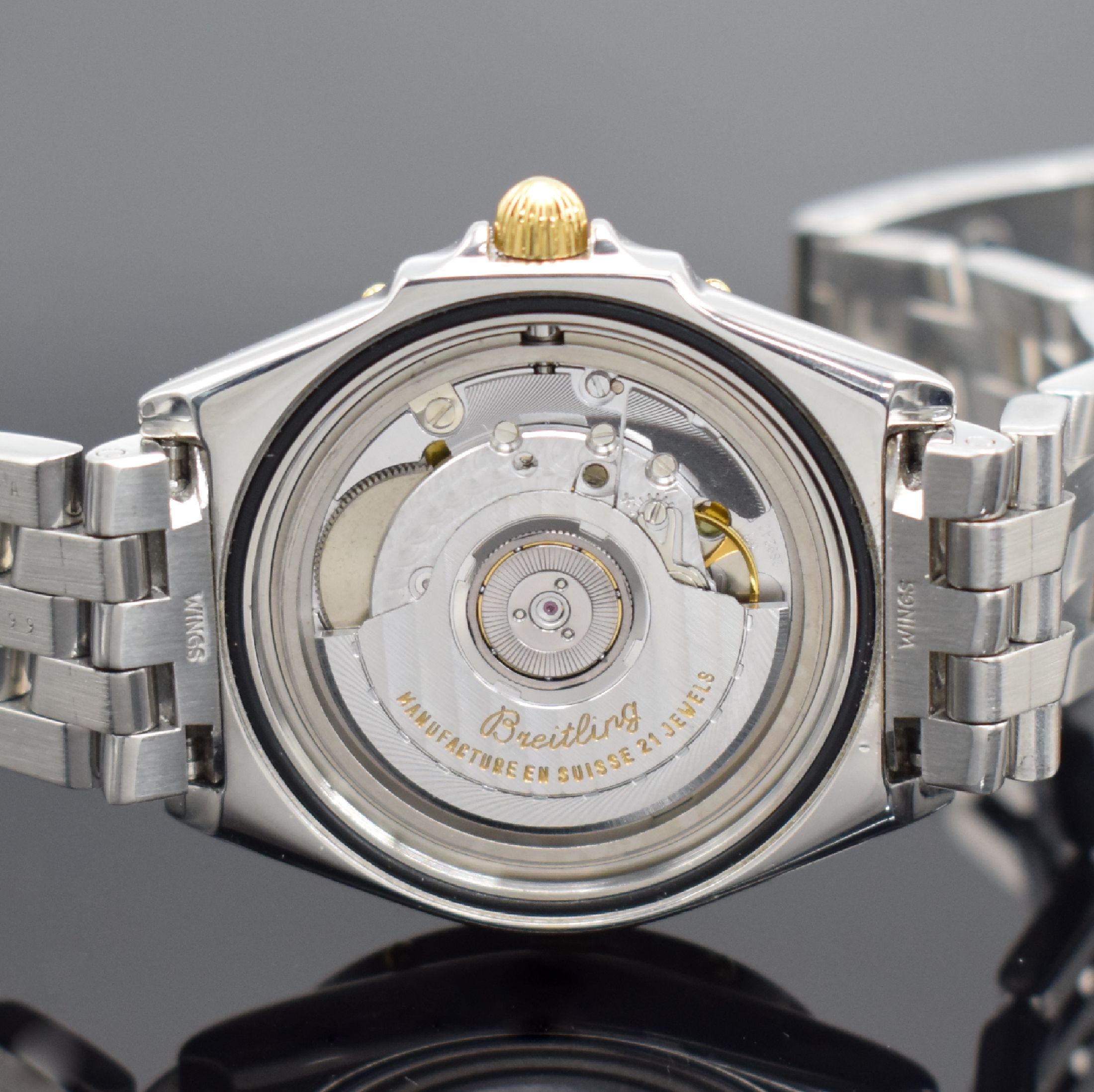 Detail e: BREITLING Mediumarmbanduhr Modellserie Wings Referenz B10050,Schweiz um 1999, Automatik, Edelstahlgeh. inkl. Gliederband m. Faltschl., Krone & Reiter ...