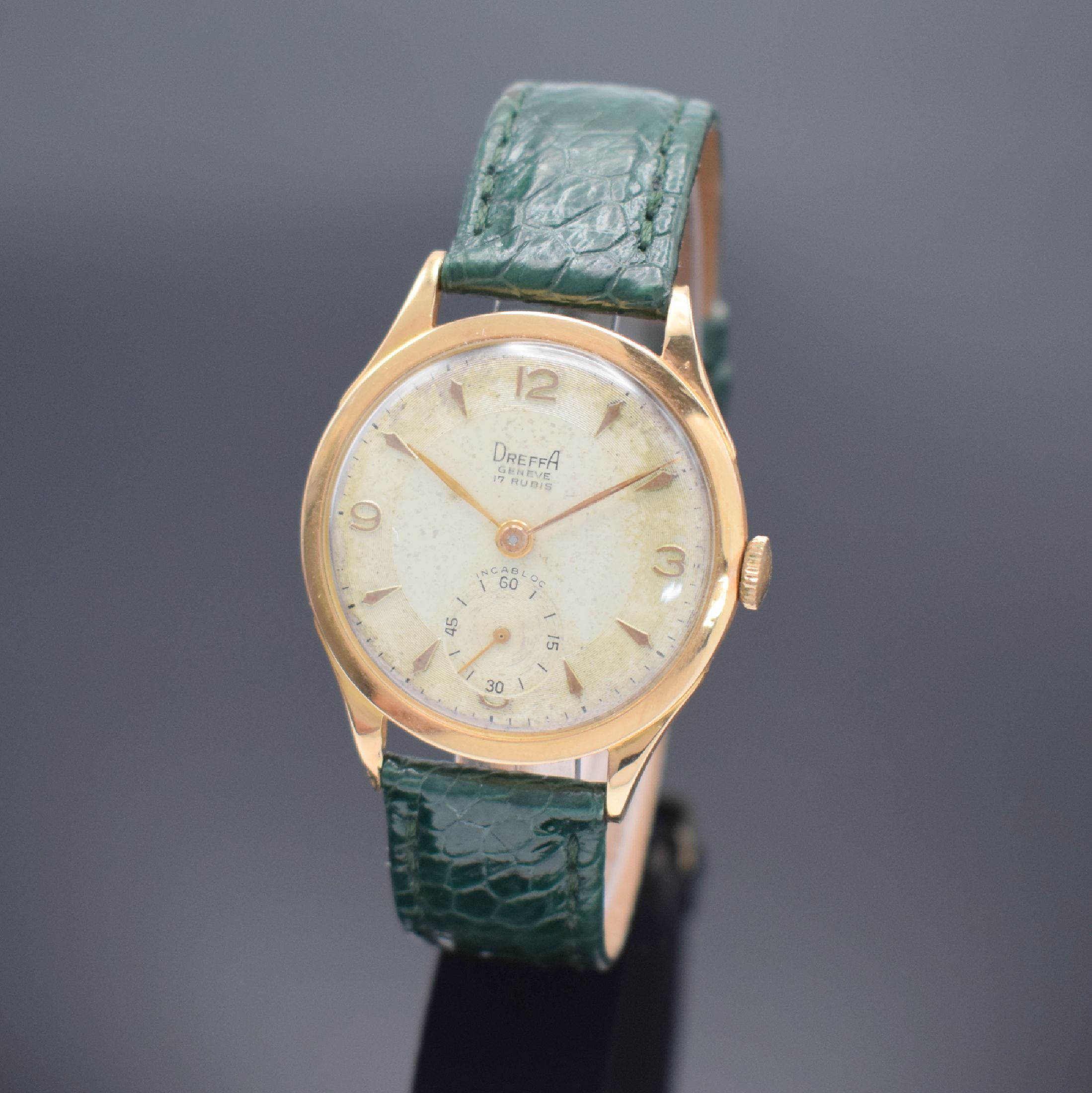 DREFFA Geneve Herrenarmbanduhr in RG 750/000, Schweiz um 1950, Handaufzug, gedr. Boden dell., silb. Zifferbl. altersbed. pat./fl., gold. Std.-Ind. & ...