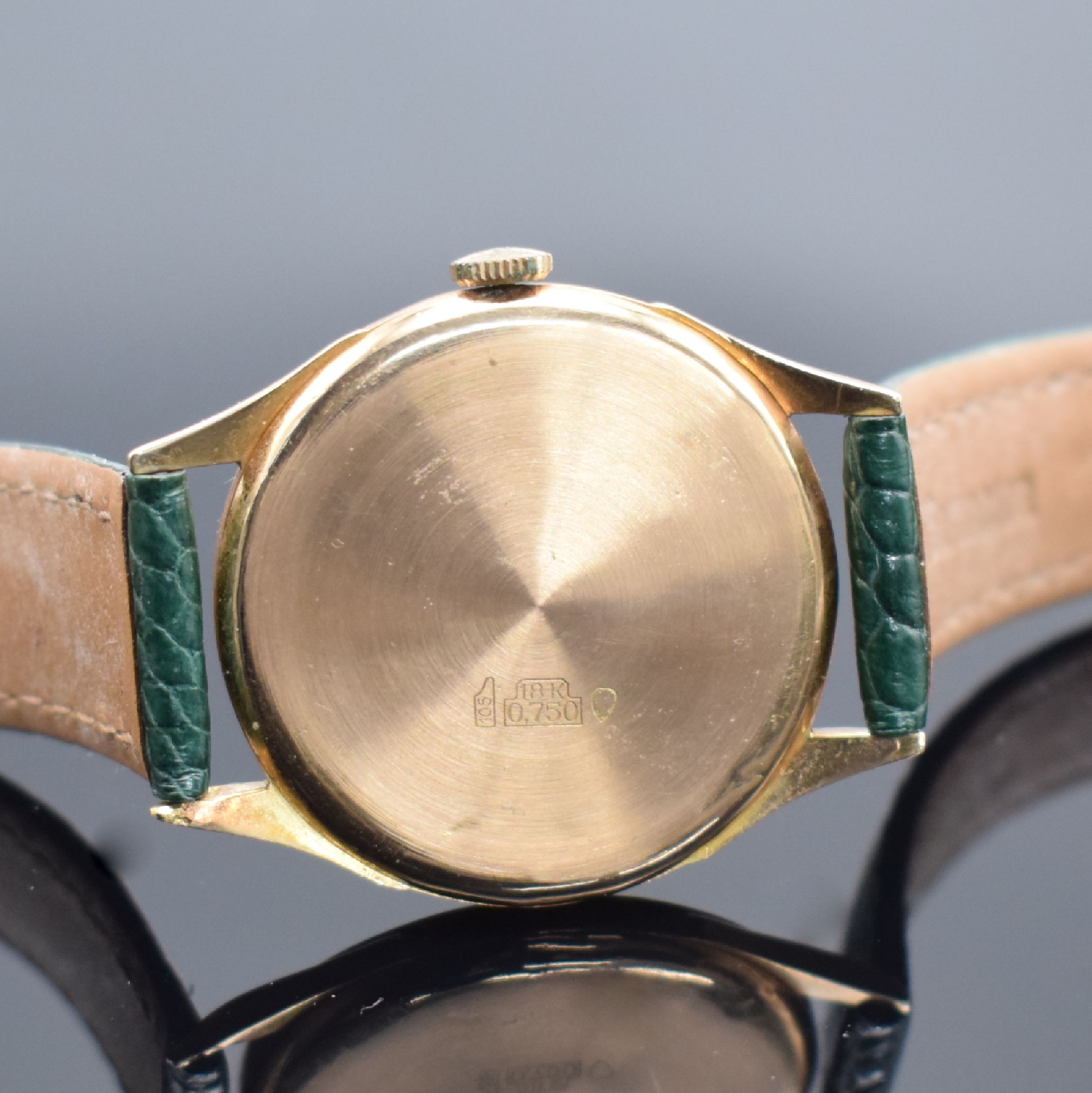Detail c: DREFFA Geneve Herrenarmbanduhr in RG 750/000, Schweiz um 1950, Handaufzug, gedr. Boden dell., silb. Zifferbl. altersbed. pat./fl., gold. Std.-Ind. & ...