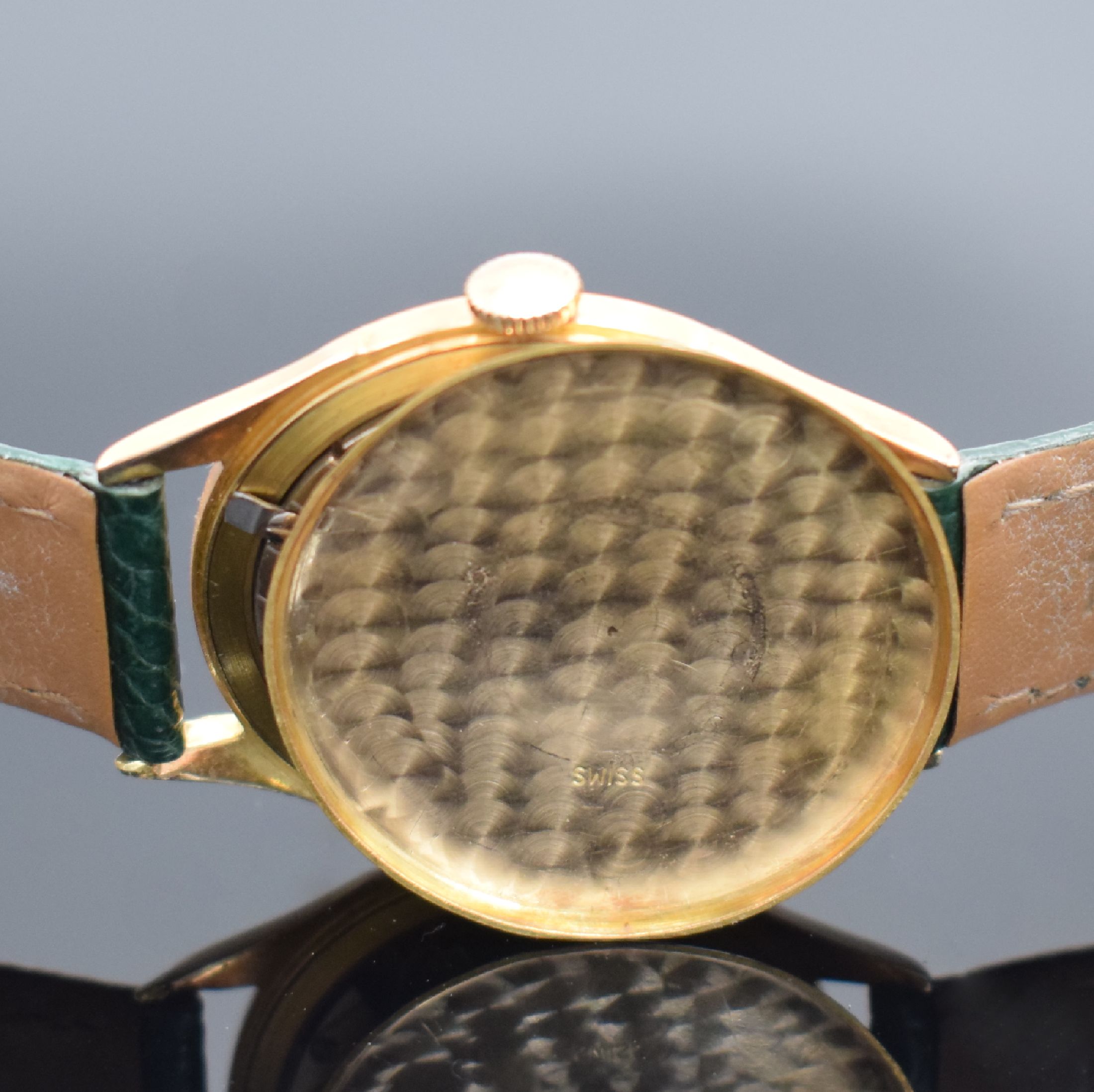 Detail e: DREFFA Geneve Herrenarmbanduhr in RG 750/000, Schweiz um 1950, Handaufzug, gedr. Boden dell., silb. Zifferbl. altersbed. pat./fl., gold. Std.-Ind. & ...