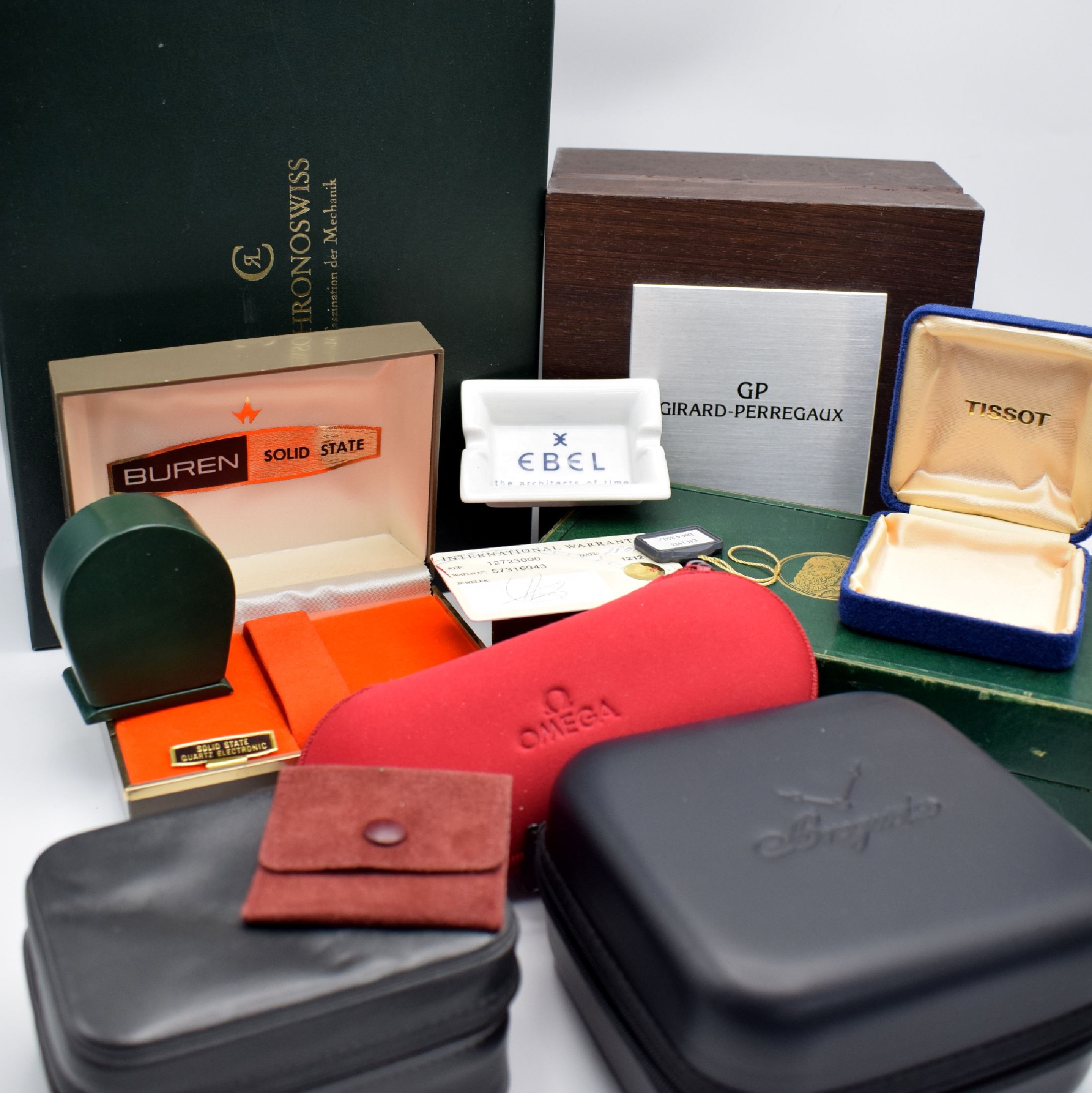 Detail a: Konvolut Uhrenboxen & Zubehör, um 1950-2010, -im Einzelnen: Omega Servicebox, Breguet Servicebox, Ebel Box, Jaeger Reisewecker-Box, Tissot Box, ...