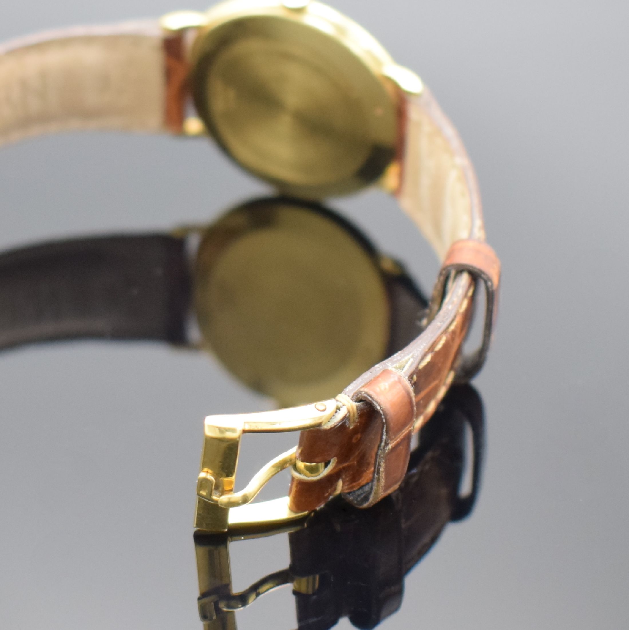 Detail b: PIAGET Armbanduhr in GG 750/000 Referenz 9035, Handaufzug, Schweiz um 1990, Lederband m. orig. GG 750/000 Dornschl., Boden aufgedr., emailfarb. ...