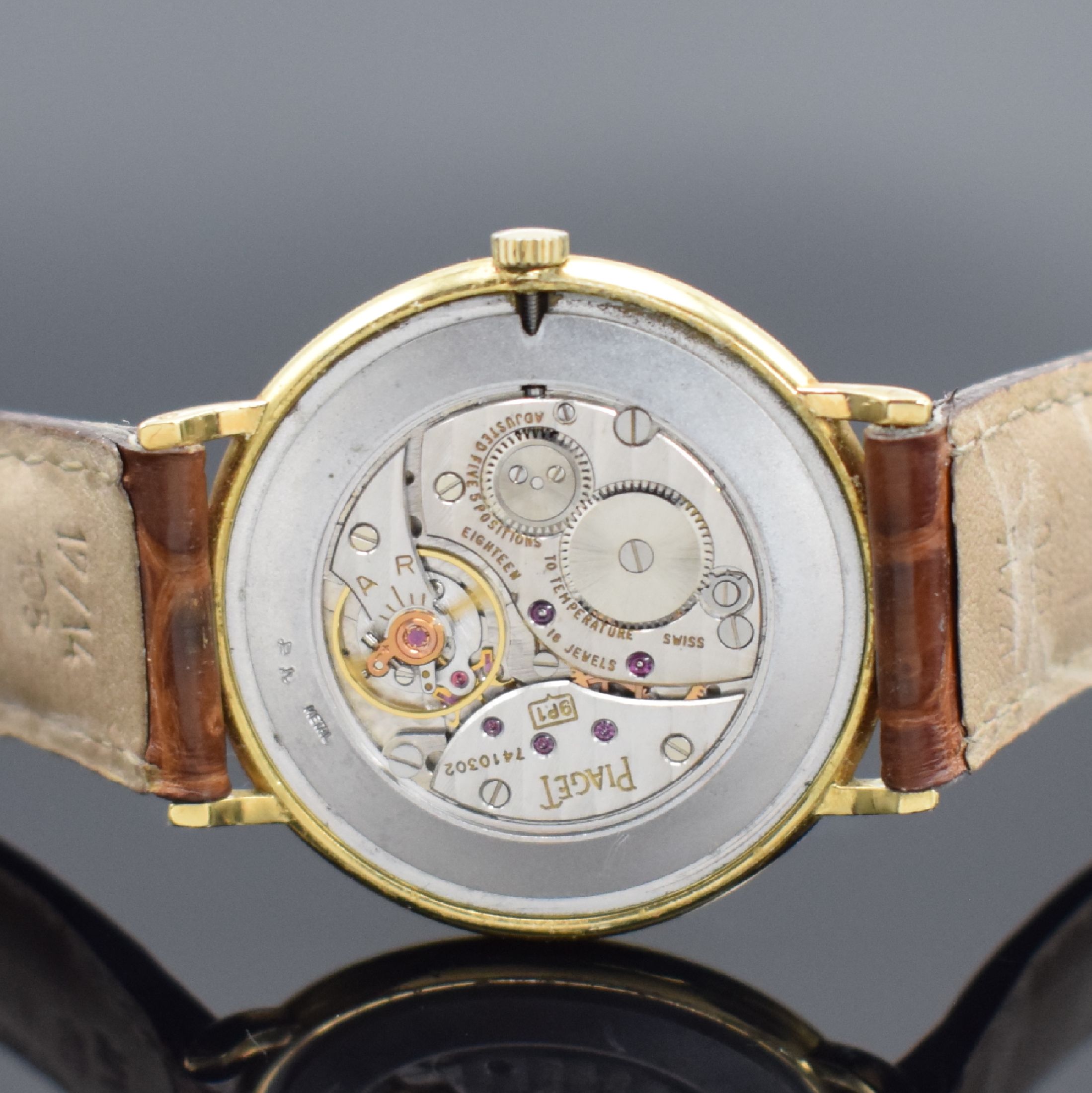 Detail e: PIAGET Armbanduhr in GG 750/000 Referenz 9035, Handaufzug, Schweiz um 1990, Lederband m. orig. GG 750/000 Dornschl., Boden aufgedr., emailfarb. ...