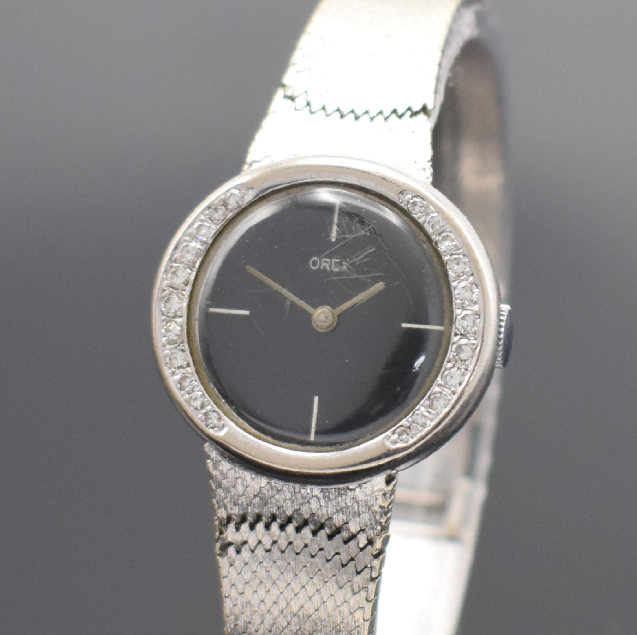 Detail a: OREX Damenarmbanduhr in WG 585/000, Schweiz um 1965, Handaufzug, 2-teil. Geh., Boden aufgedr., Lünette m. Diamanten bes., Milanaiseband in WG ...