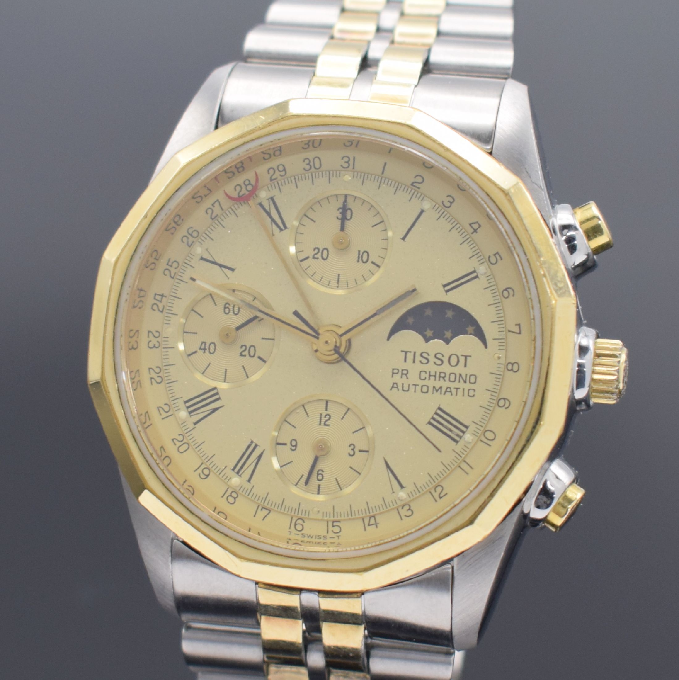 Detail a: TISSOT PR 100 Herrenchronograph in Stahl/ vergoldet, Schweiz verk. lt. beil. Garantie 11/1985, Automatik, verschr. Geh., verg. 12- eckige Lünette, ...
