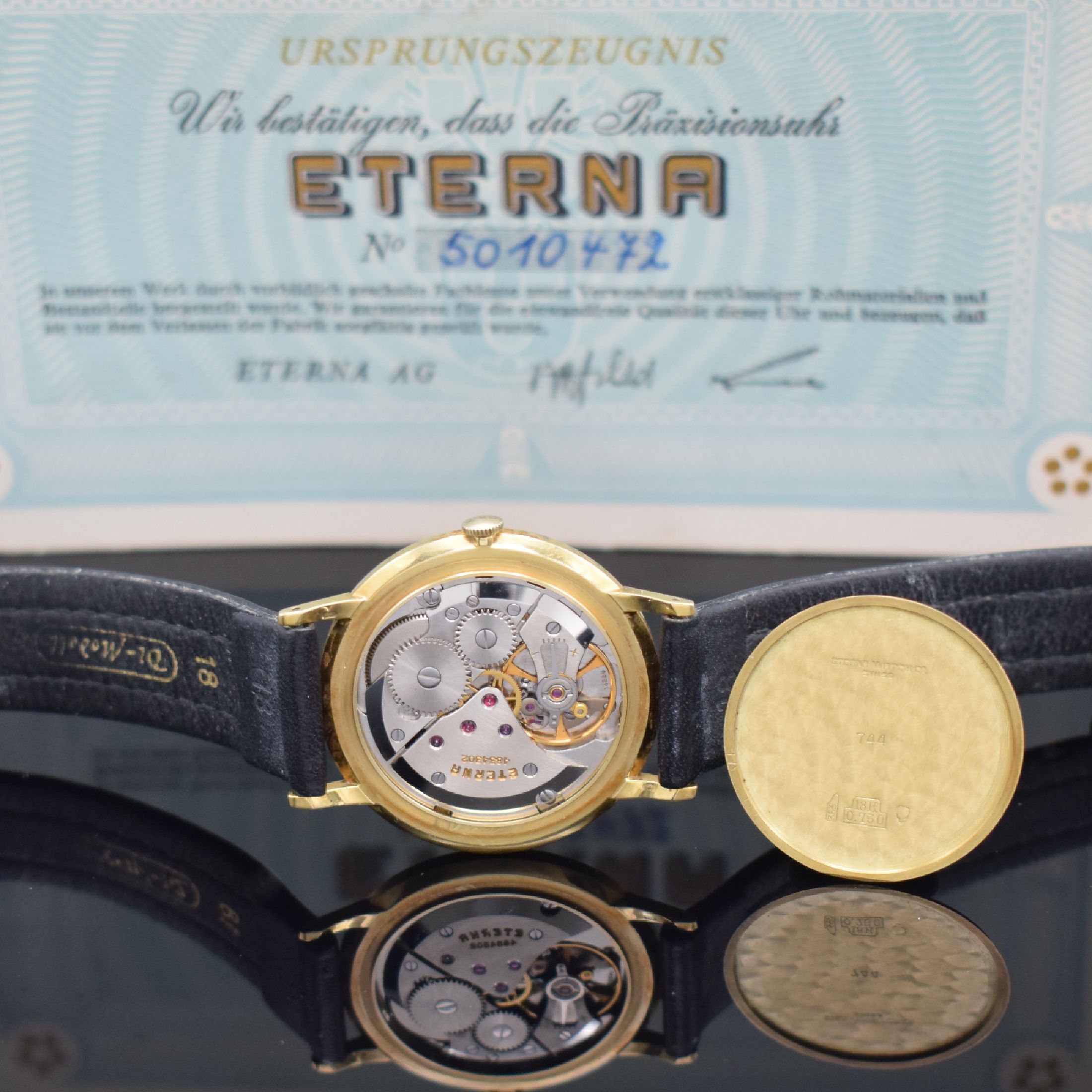 Detail g: ETERNA Herrenarmbanduhr in GG 750/000 mit original Papier Referenz 744, Schweiz verk. lt. Papier 1964, Handaufzug, flaches Geh., Boden & Glasrand ...