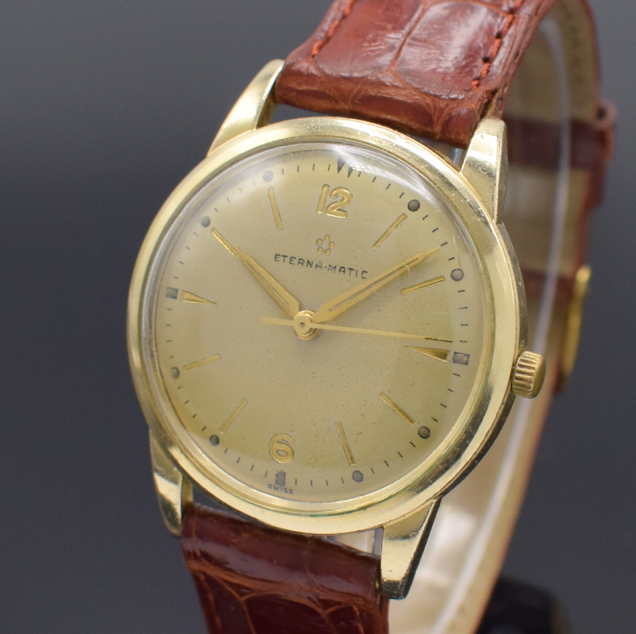 Detail a: ETERNA-MATIC Herrenarmbanduhr, Schweiz um 1955, Automatik, gold filled Geh., Stahlboden verschr., pat. Zifferbl. m. gold. Std.-Ind., gold. Zeiger, ...
