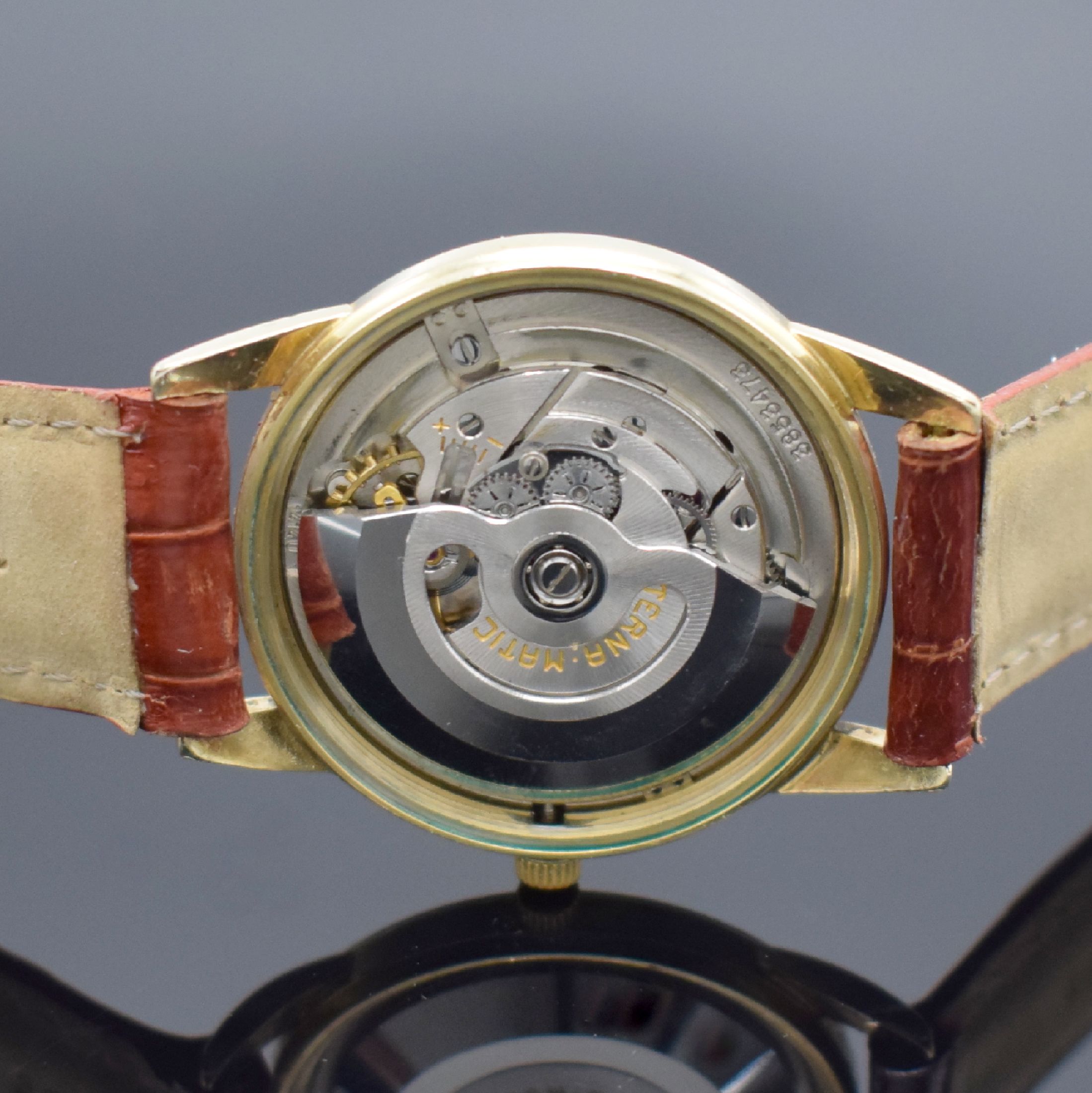 Detail d: ETERNA-MATIC Herrenarmbanduhr, Schweiz um 1955, Automatik, gold filled Geh., Stahlboden verschr., pat. Zifferbl. m. gold. Std.-Ind., gold. Zeiger, ...