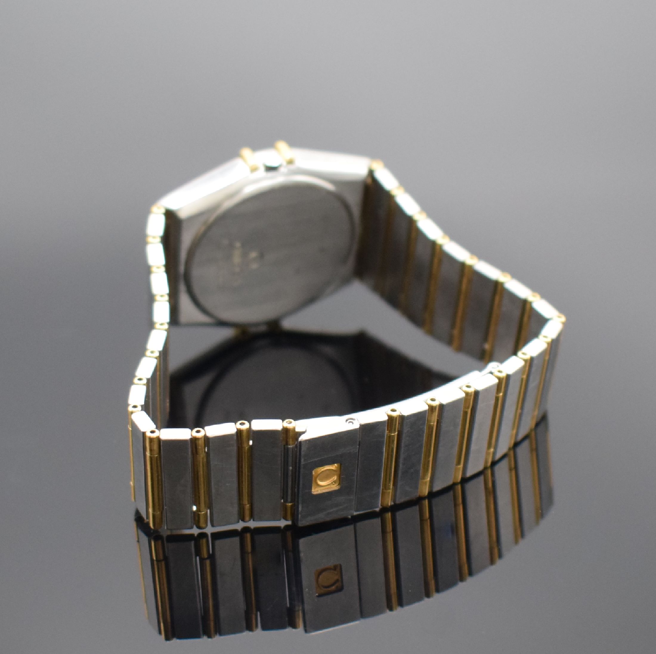 Detail b: OMEGA Constellation Herrenarmbanduhr in Stahl/Gold, Schweiz um 1995, quarz, orig. Gliederband m. Faltschl., Boden aufgedr., Goldlünette m. röm. ...