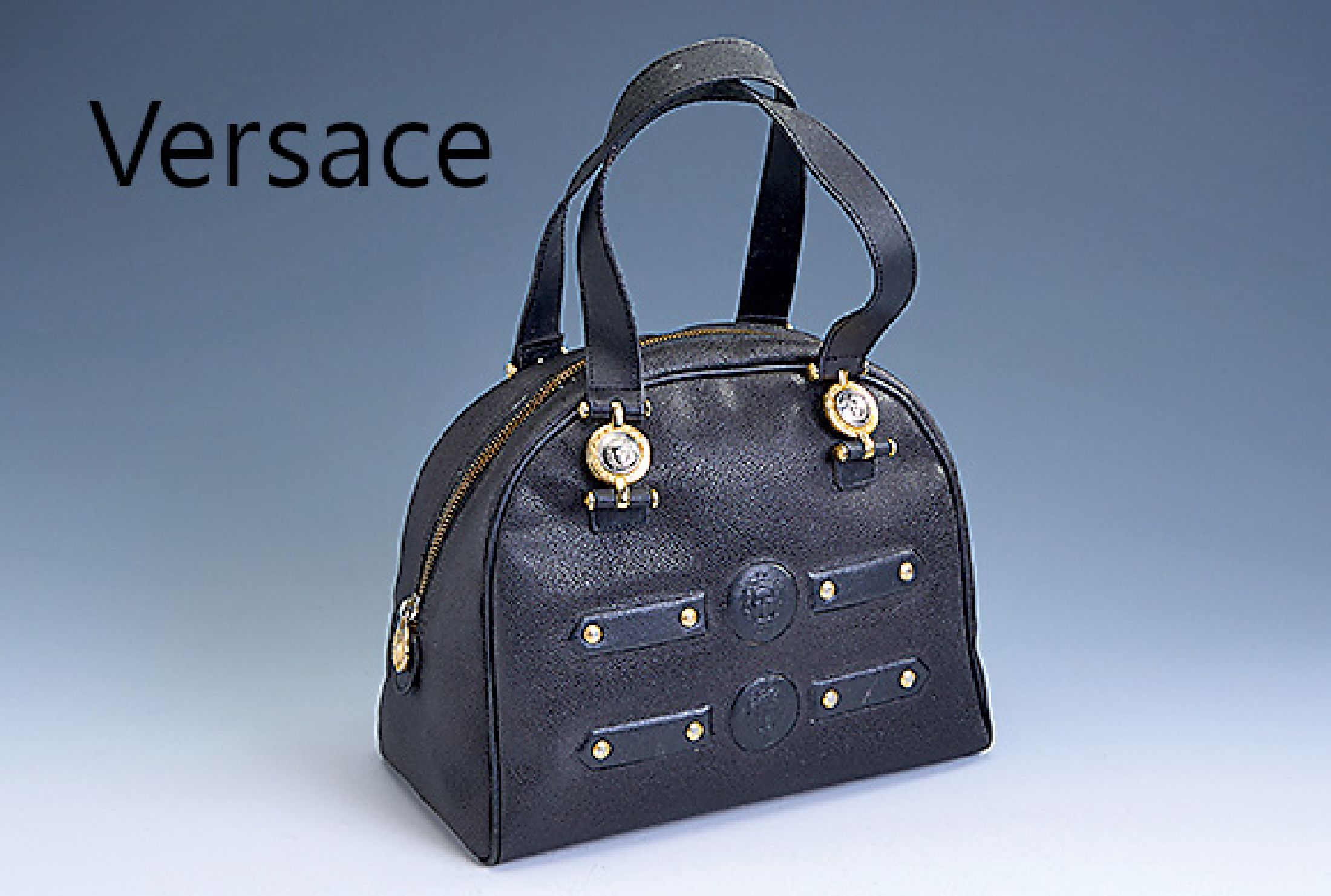 GIANNI VERSACE Henkeltasche, Vintage, schwarzes genarbtes Leder, mit goldfarbenen Medusa-Köpfen verz., schwarzes Innenfutter mitLogo, 1 seitl. Fach ...