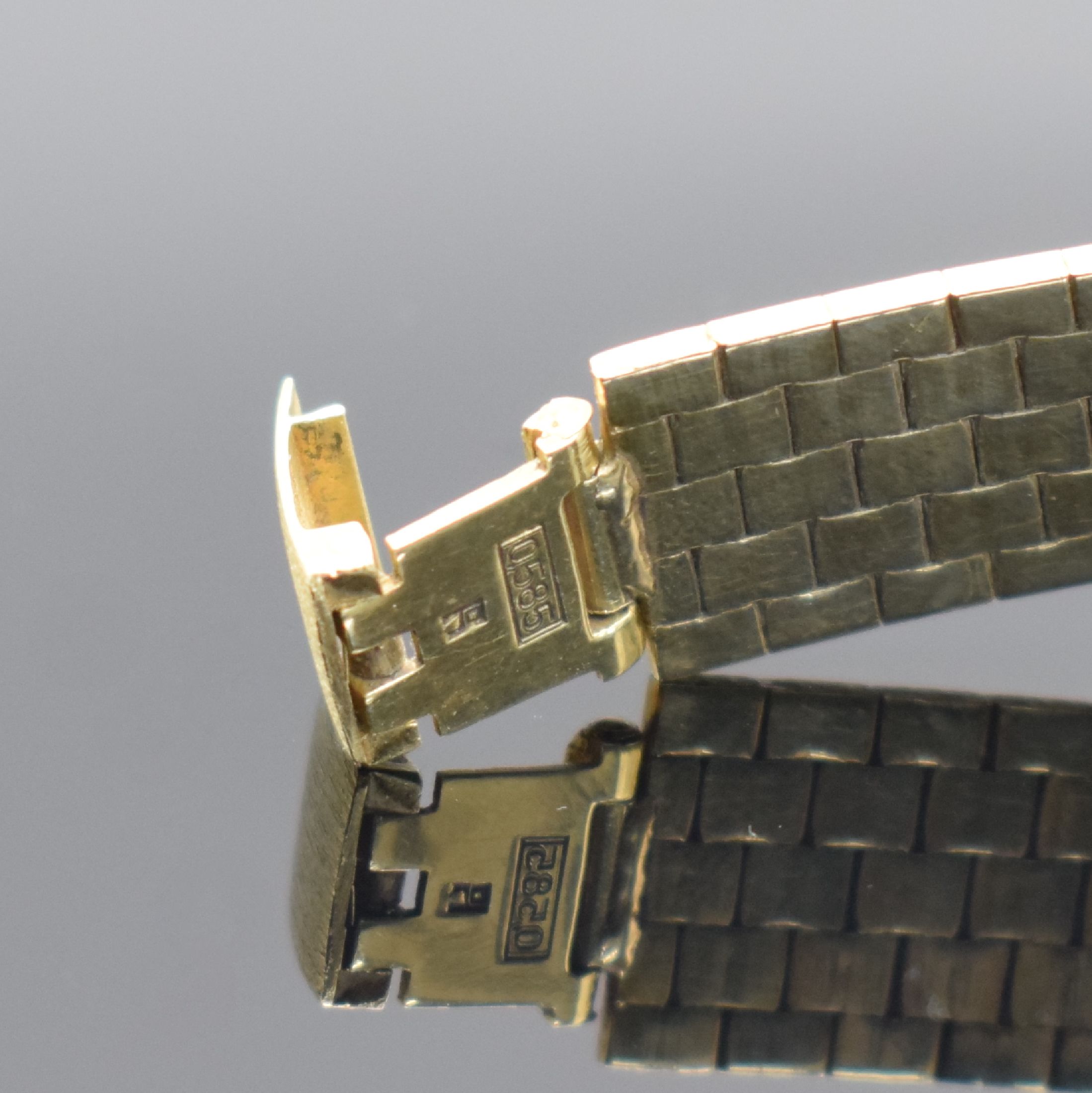 Detail b: MONDIA Herrenarmbanduhr in GG 585/000, Schweiz um 1970, Automatik, Boden aufgedr., silb. Zifferbl. m. aufgel. Std.-Ind., schwarze Zeiger, Datum b. 3, ...