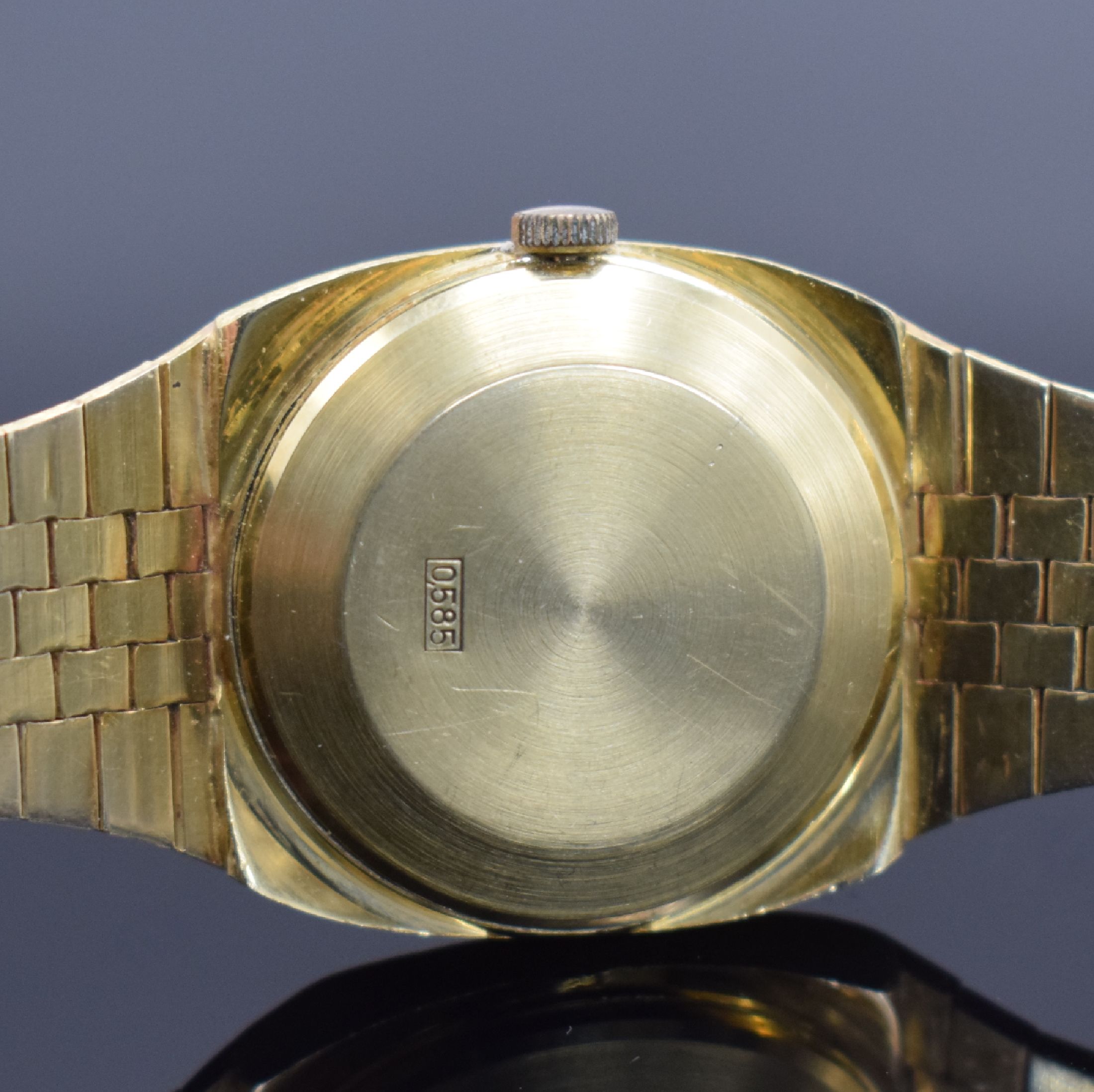 Detail c: MONDIA Herrenarmbanduhr in GG 585/000, Schweiz um 1970, Automatik, Boden aufgedr., silb. Zifferbl. m. aufgel. Std.-Ind., schwarze Zeiger, Datum b. 3, ...