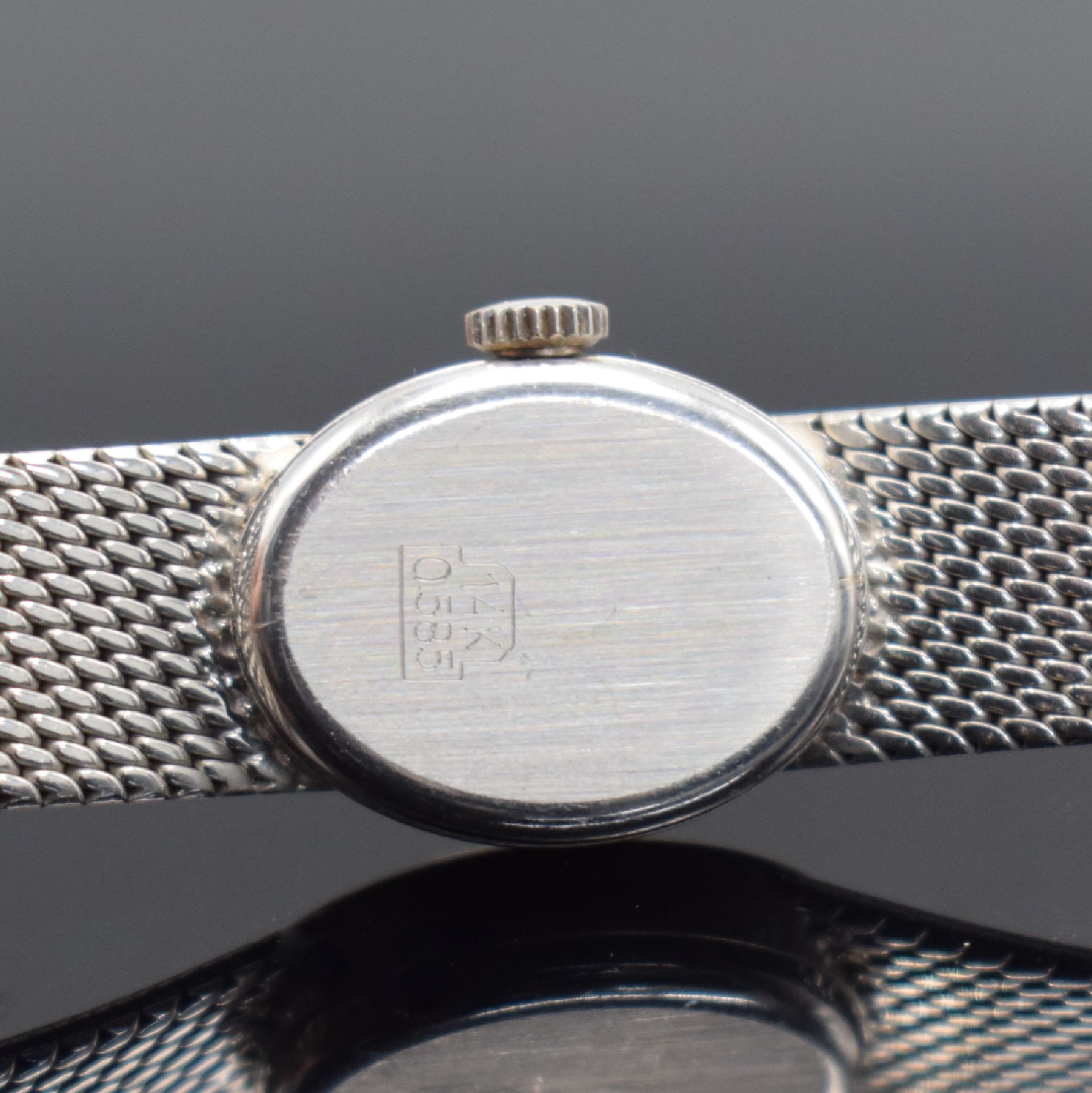 Detail c: MONDIA Damenarmbanduhr in WG 585/000, Schweiz um 1970, Handaufzug, Boden aufgedr., silb. Zifferbl. m. aufgel. Std.-Ind., schwarze Zeiger, verg. Werk ...