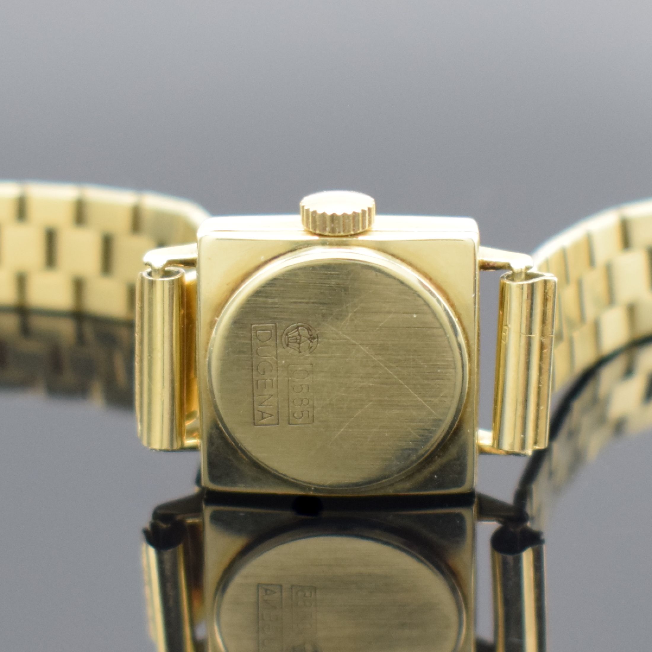 Detail c: DUGENA viereckige Damenarmbanduhr in GG 585/000, Schweiz um 1965, Handaufzug, Boden aufgedr., silb. Zifferbl. l. fl., gold. Std.- Ind. & Zeiger, Kal. ...